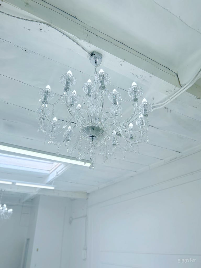  We have two large chandeliers to give our industrial space a luxurious appeal. 