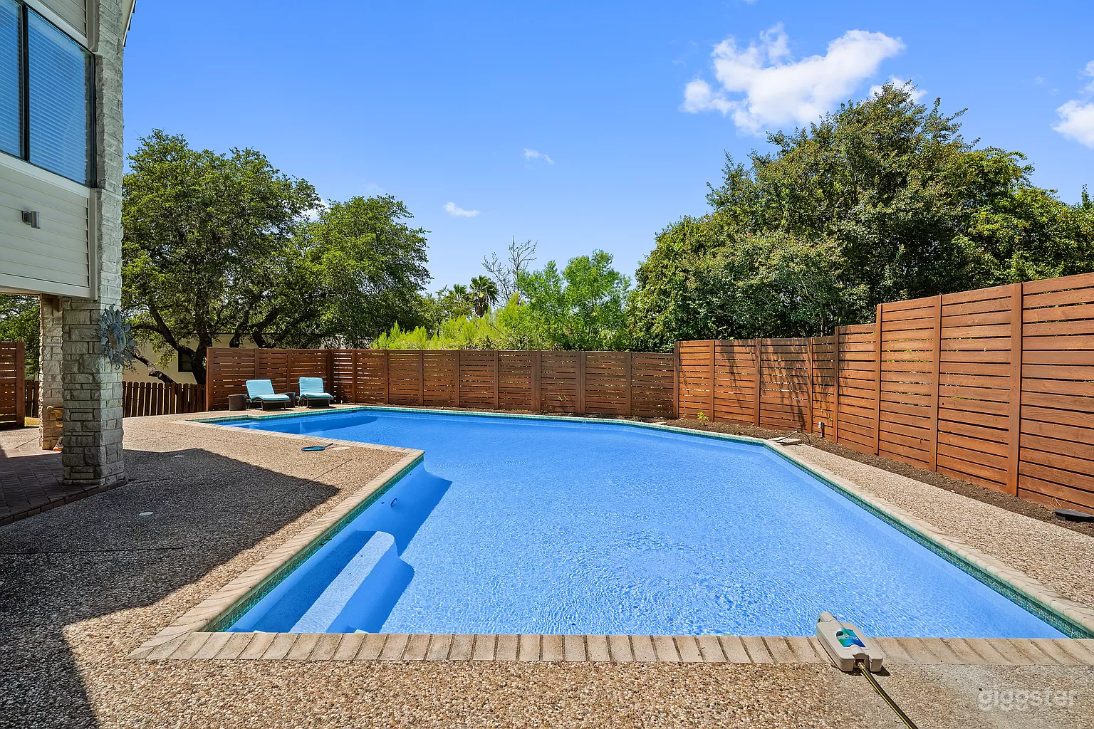 Sparkling Diving Pool with Covered Patio Photo 1