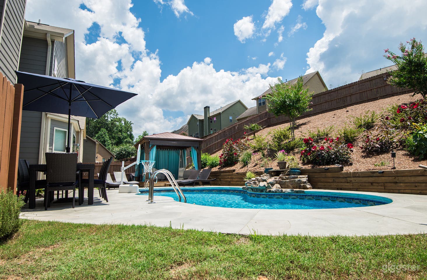 Backyard. Everything was recently paved stoned (after this picture) so there is no longer grass