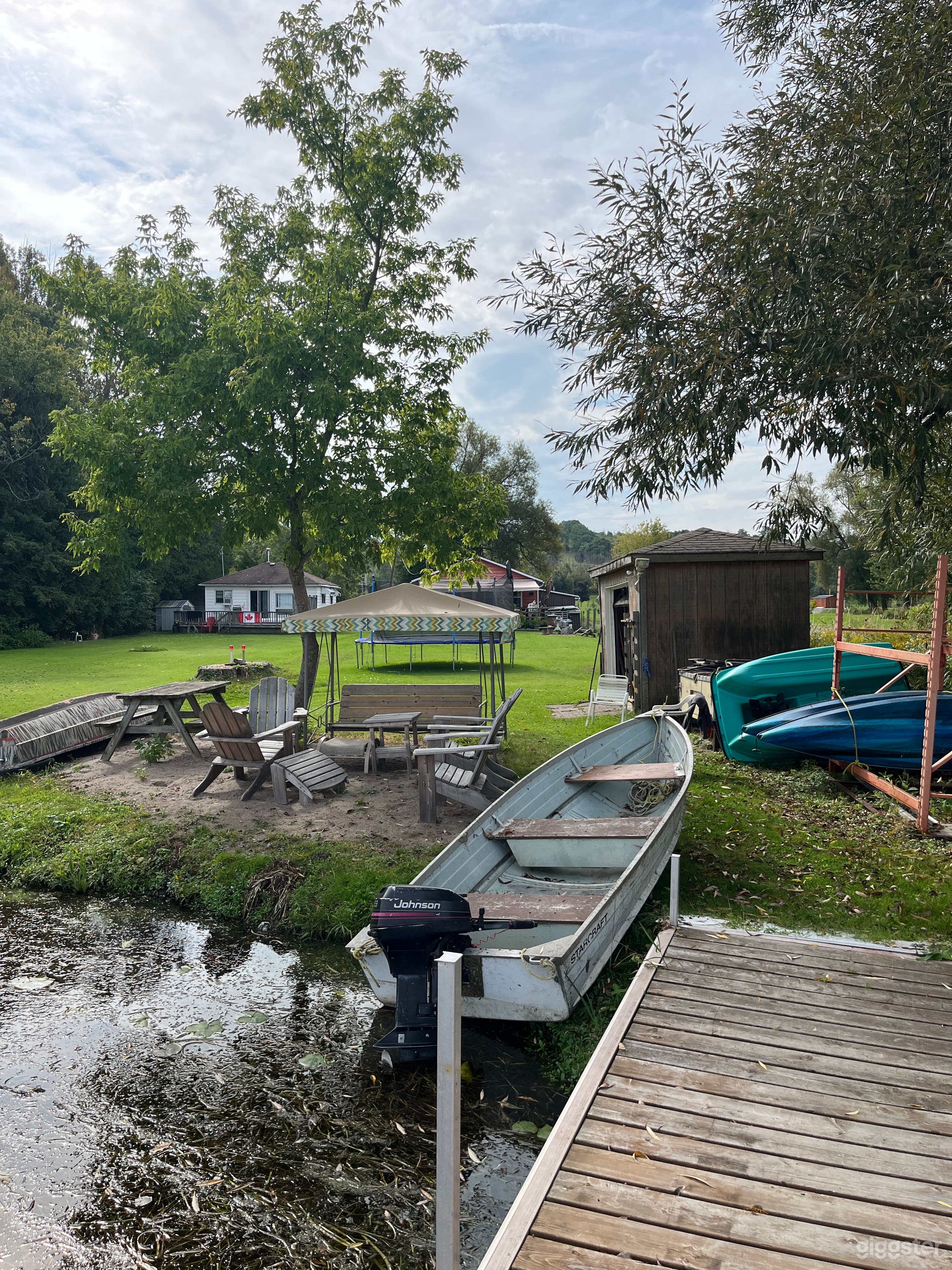 Lake Front Beach area 
Shed, swing, boats, paddle boat, 2 Kayaks, Muskoka wood chairs 4
