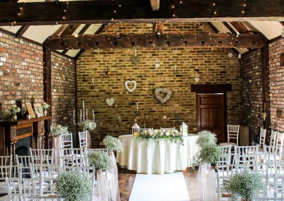Ceremony Room with Timber Rafters Under a Tile Photo 1