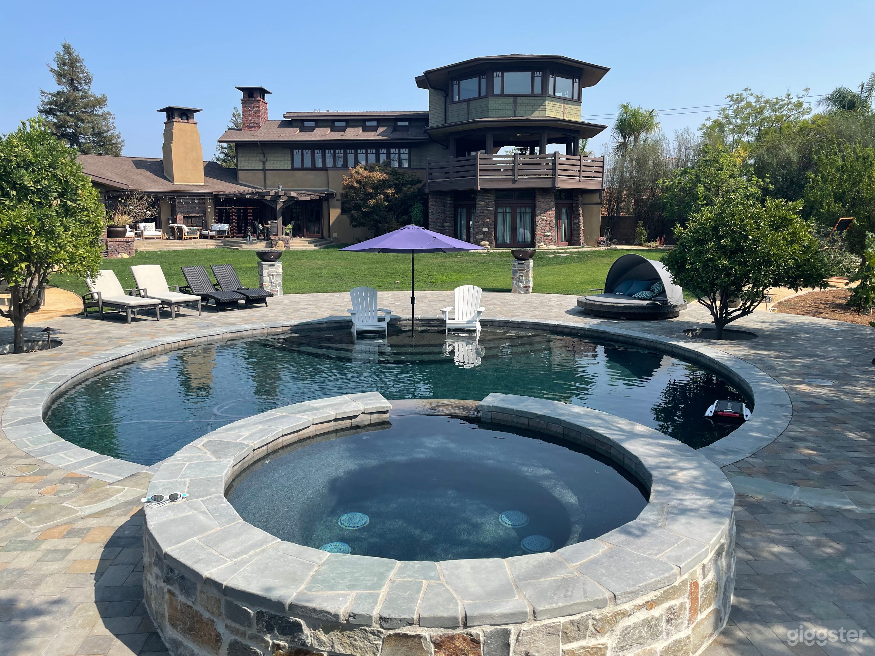 Luxurious Round Craftsman Pool and Huge Backyard Photo 1