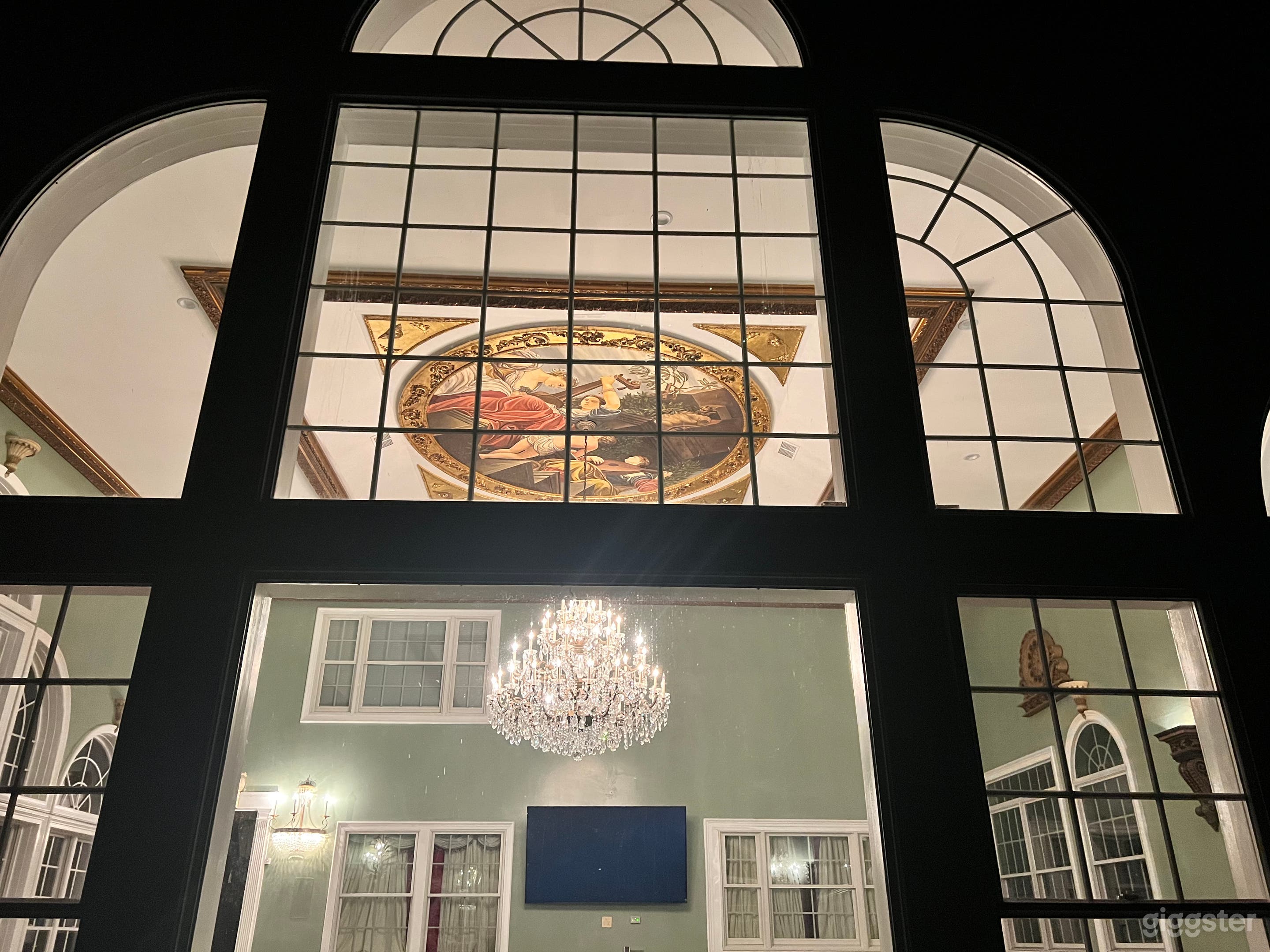 A great perspective from outside the pool room. The room is roughly 30'x32' and the TV is 86". High-end in-wall speakers connect to tv. 