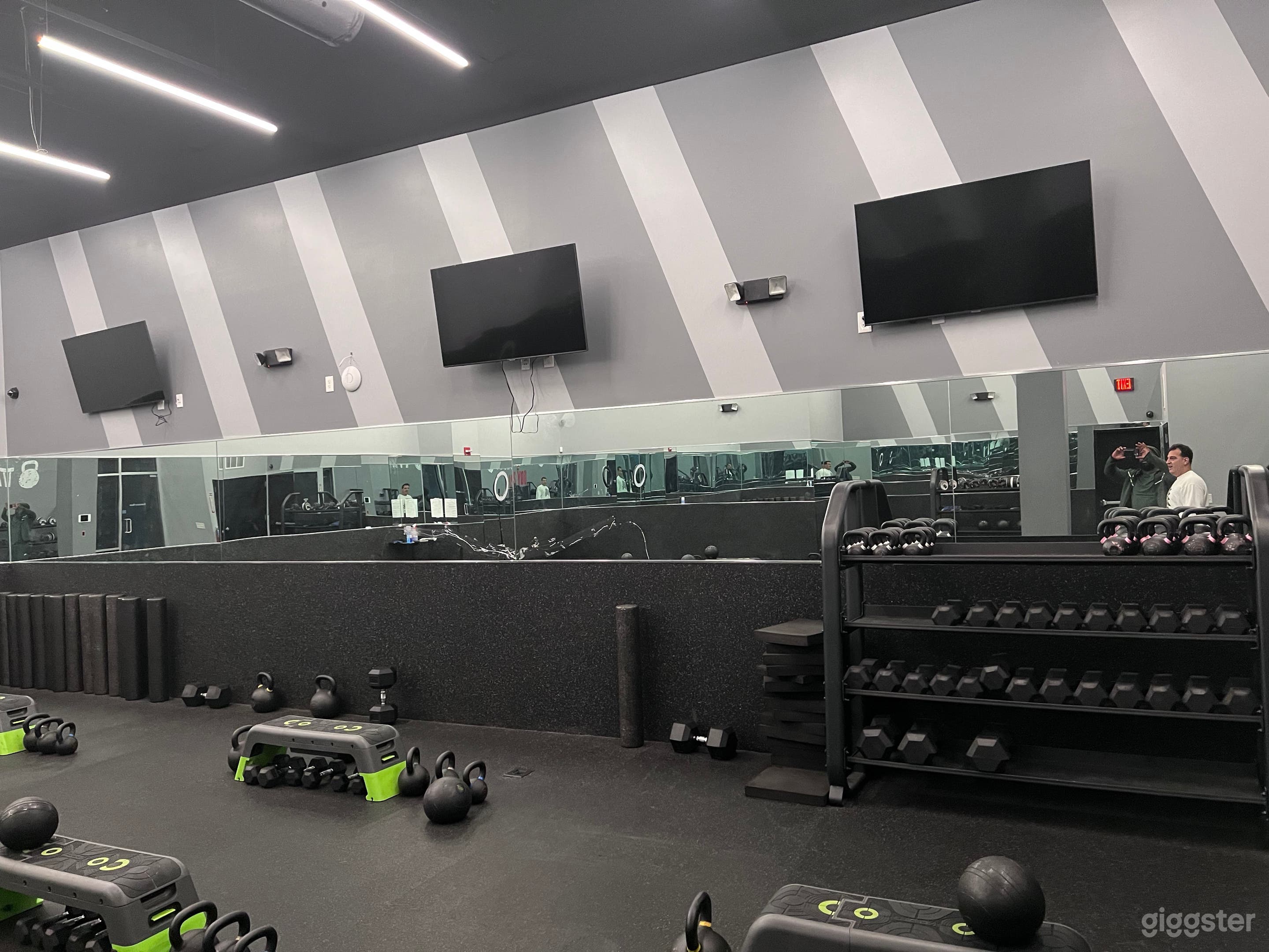 Resistance studio room with three television monitors. 