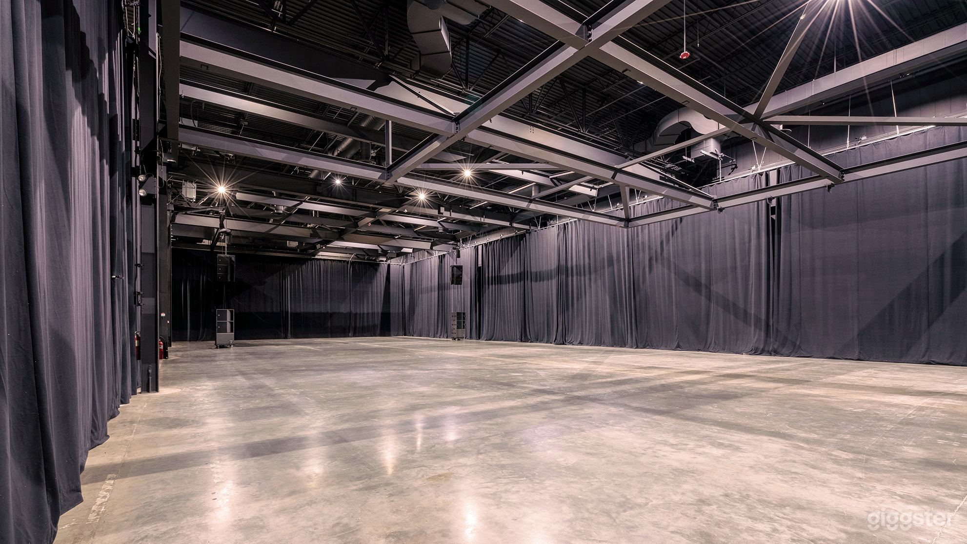 Close the curtains down the center to divide the room into two zones