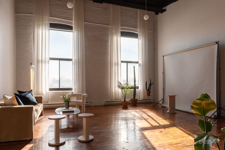  Beautifully furnished corner with studio features such as backdrops and blackout shades. 