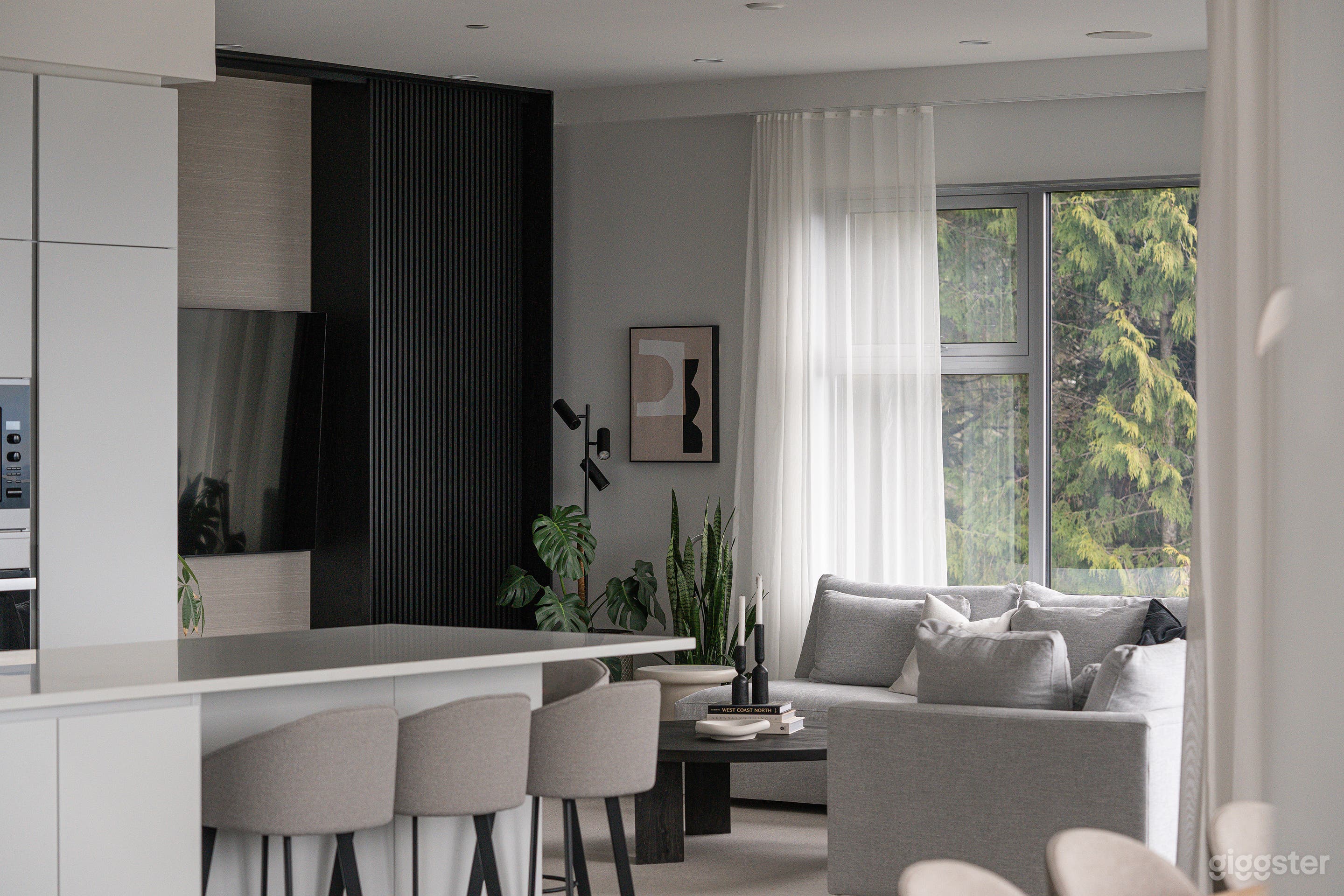 Modern House with Mountain, Water, and City Views Photo 1