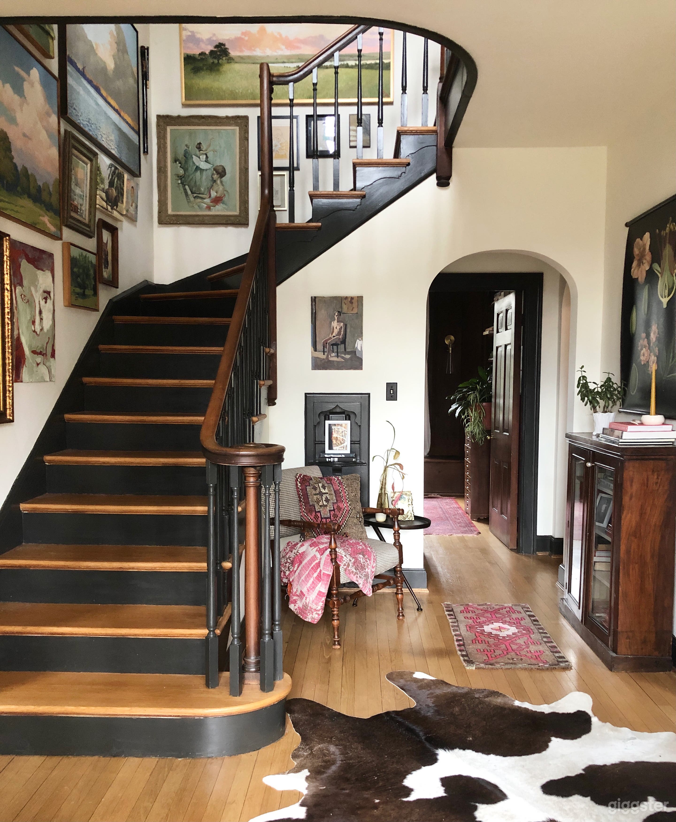 Central foyer with turned staircase and arched doorway