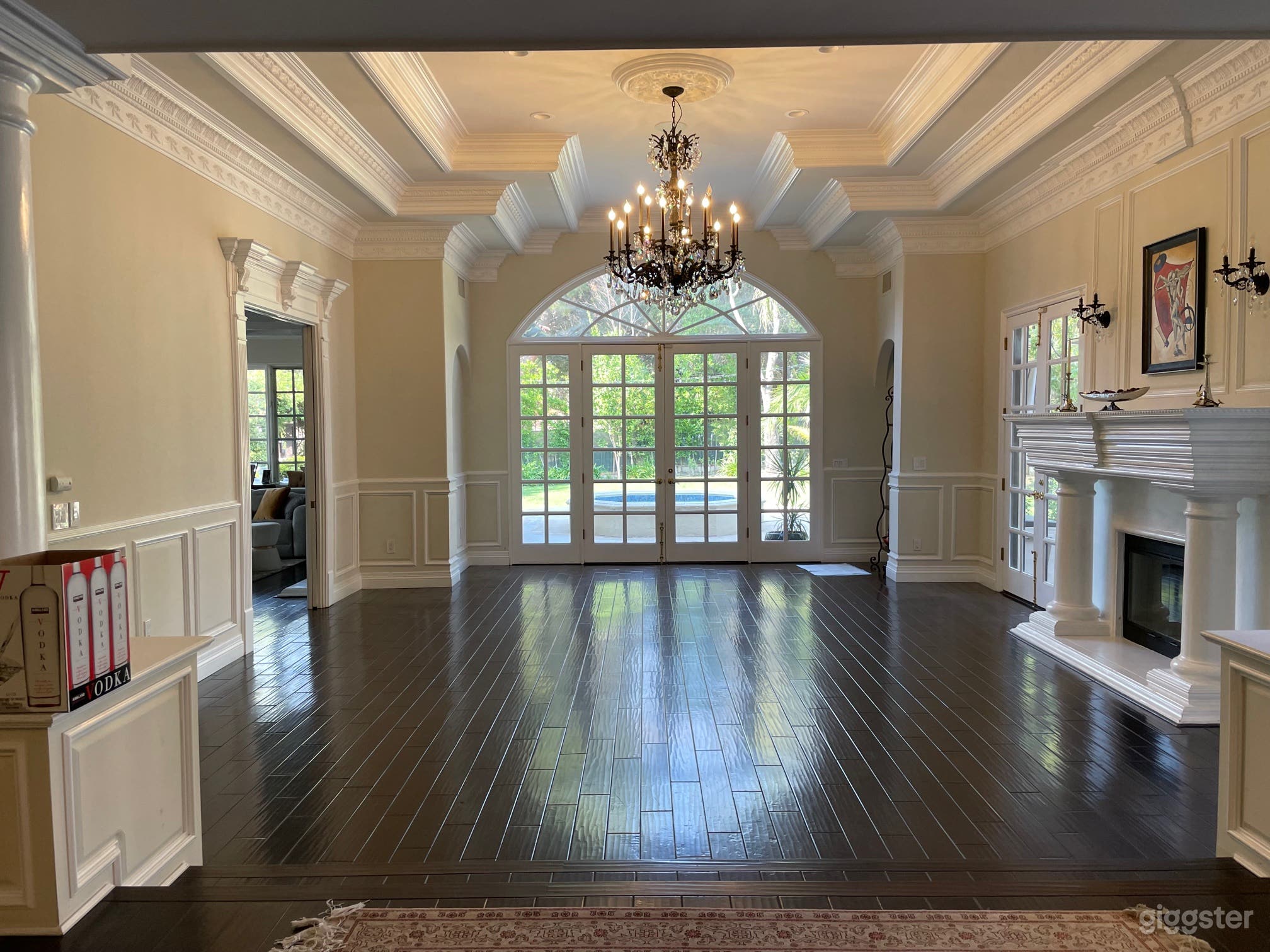 living room with fireplace facing back yard and fountain