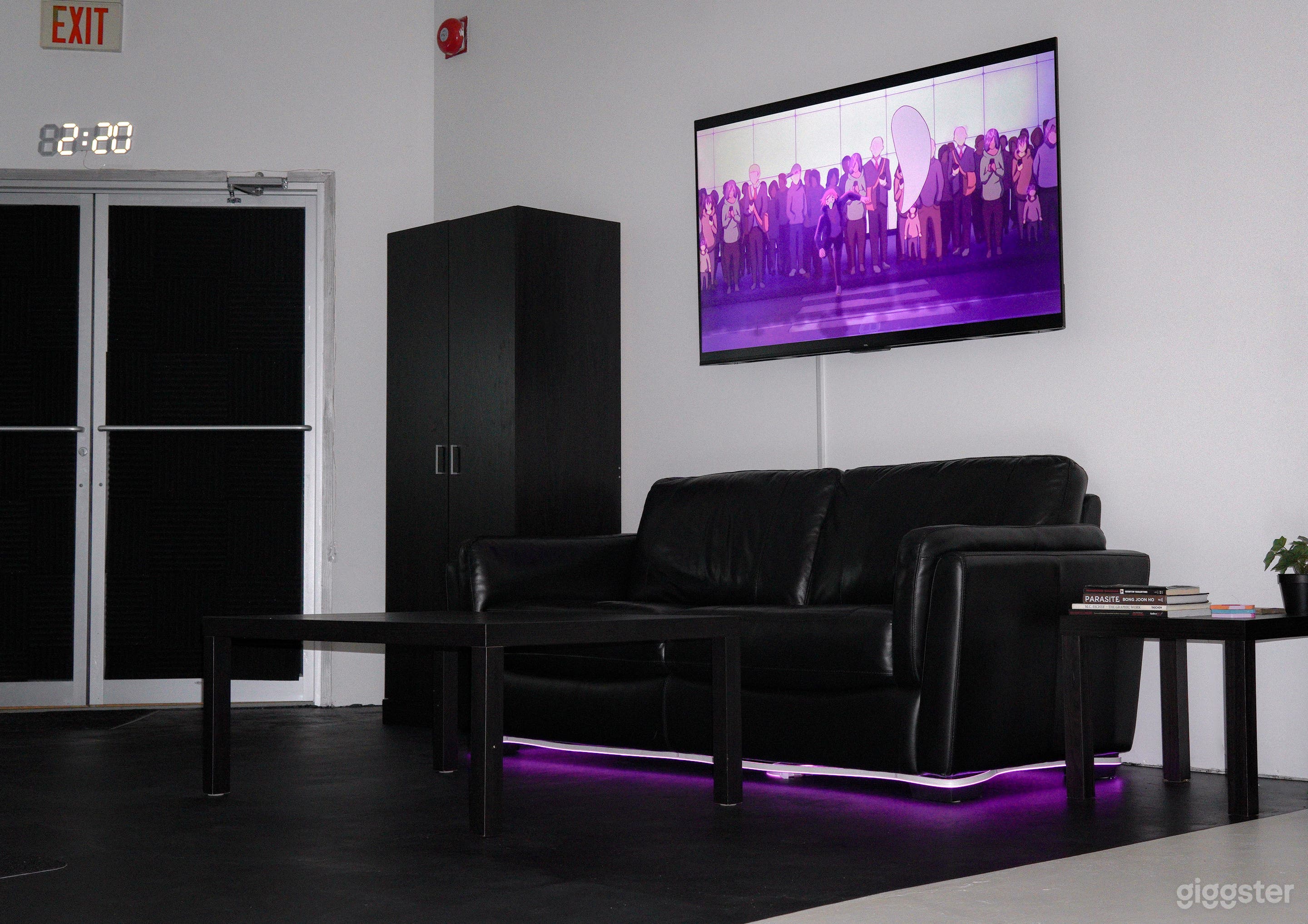 Workspace Area with 4k Smart TV and Wardrobe for storage.