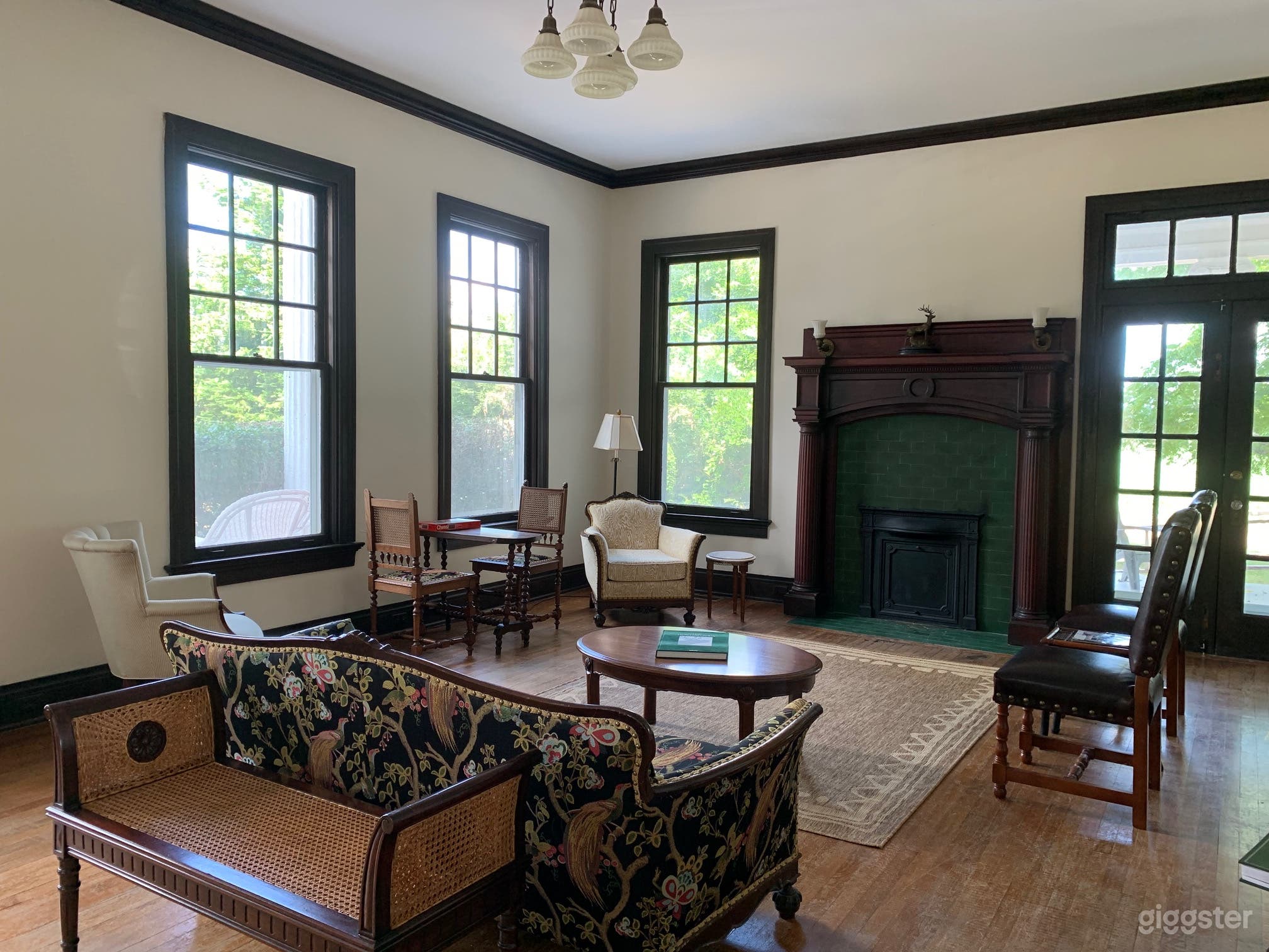 Light-filled living room with handsome fireplace 