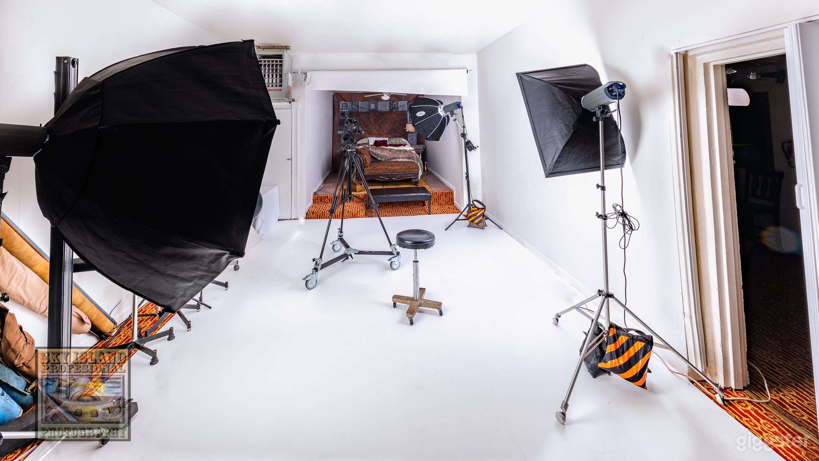 Main studio area with 107" background paper rolled up.