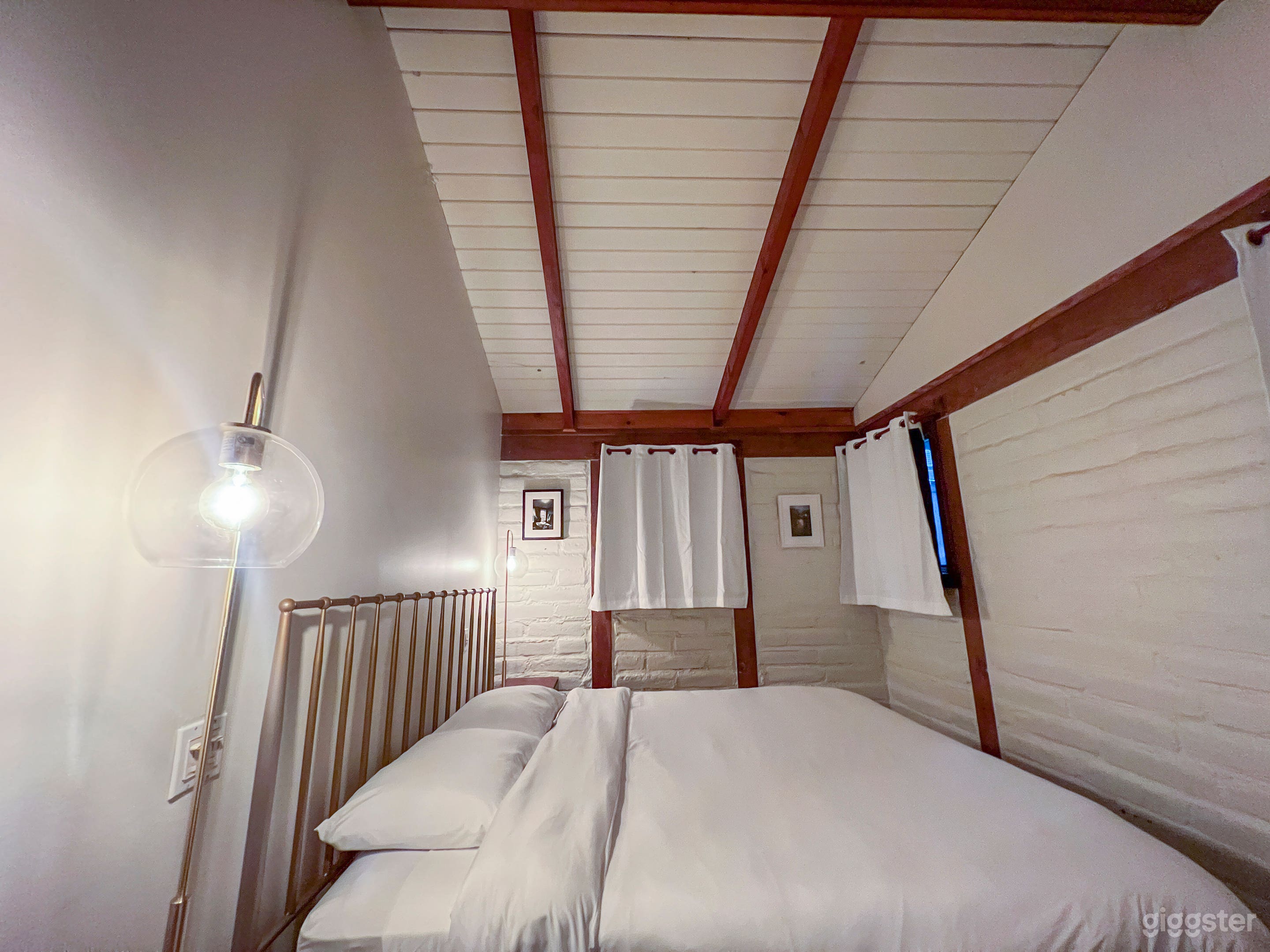 Adobe walls, vaulted ceilings and Air Conditioning / Heating surround a King side bed with blackout curtains. Large closet nearby.