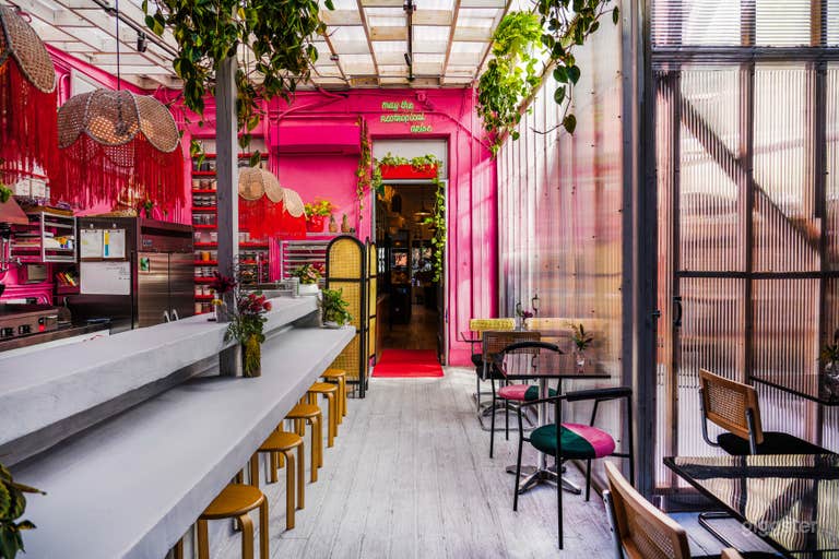  Tropical lush day-lit atrium culinary space 