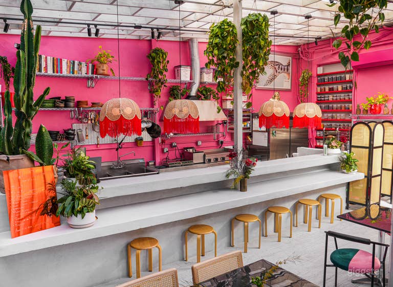  Tropical lush day-lit atrium culinary space 