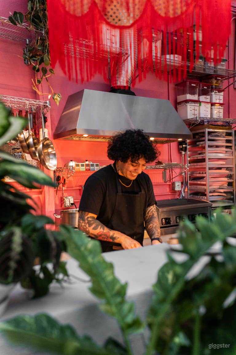  Tropical lush day-lit atrium culinary space 