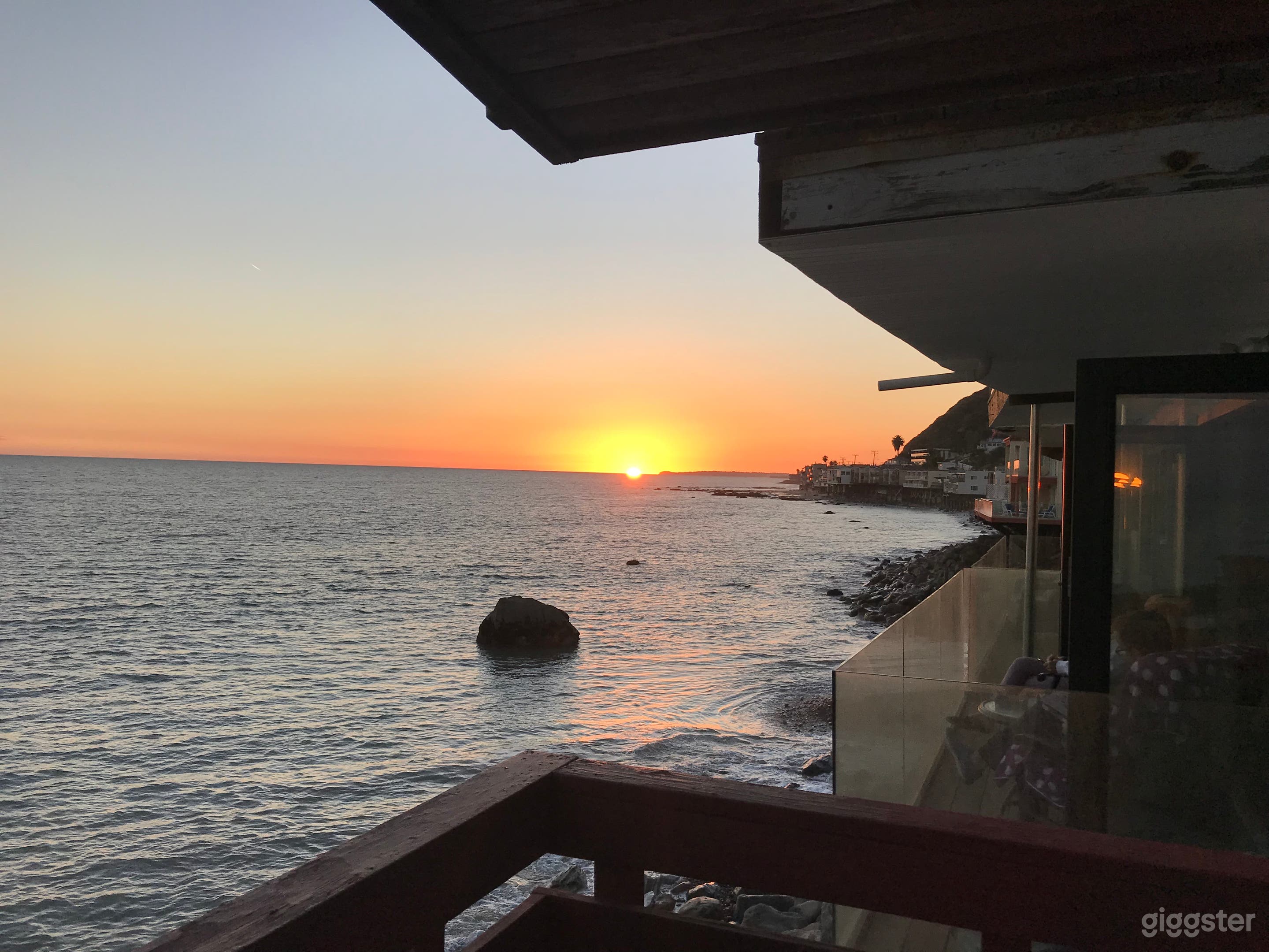 Sunset form middle deck of house.