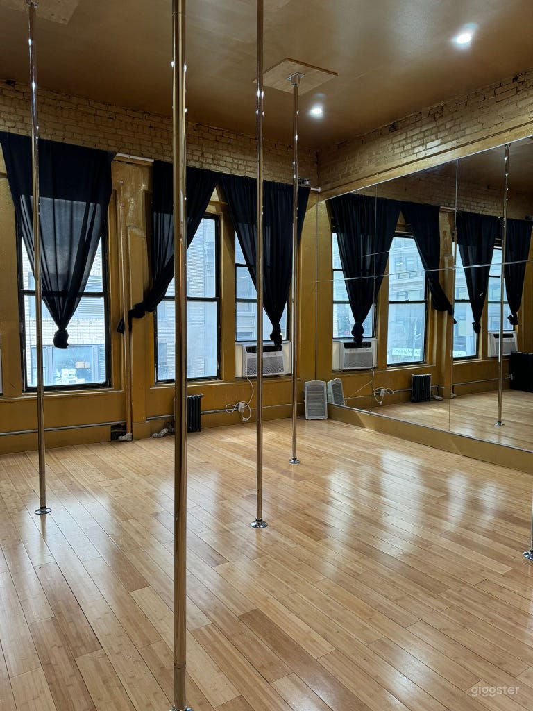  Black curtains on windows for privacy with newly furnished wooden floors. 