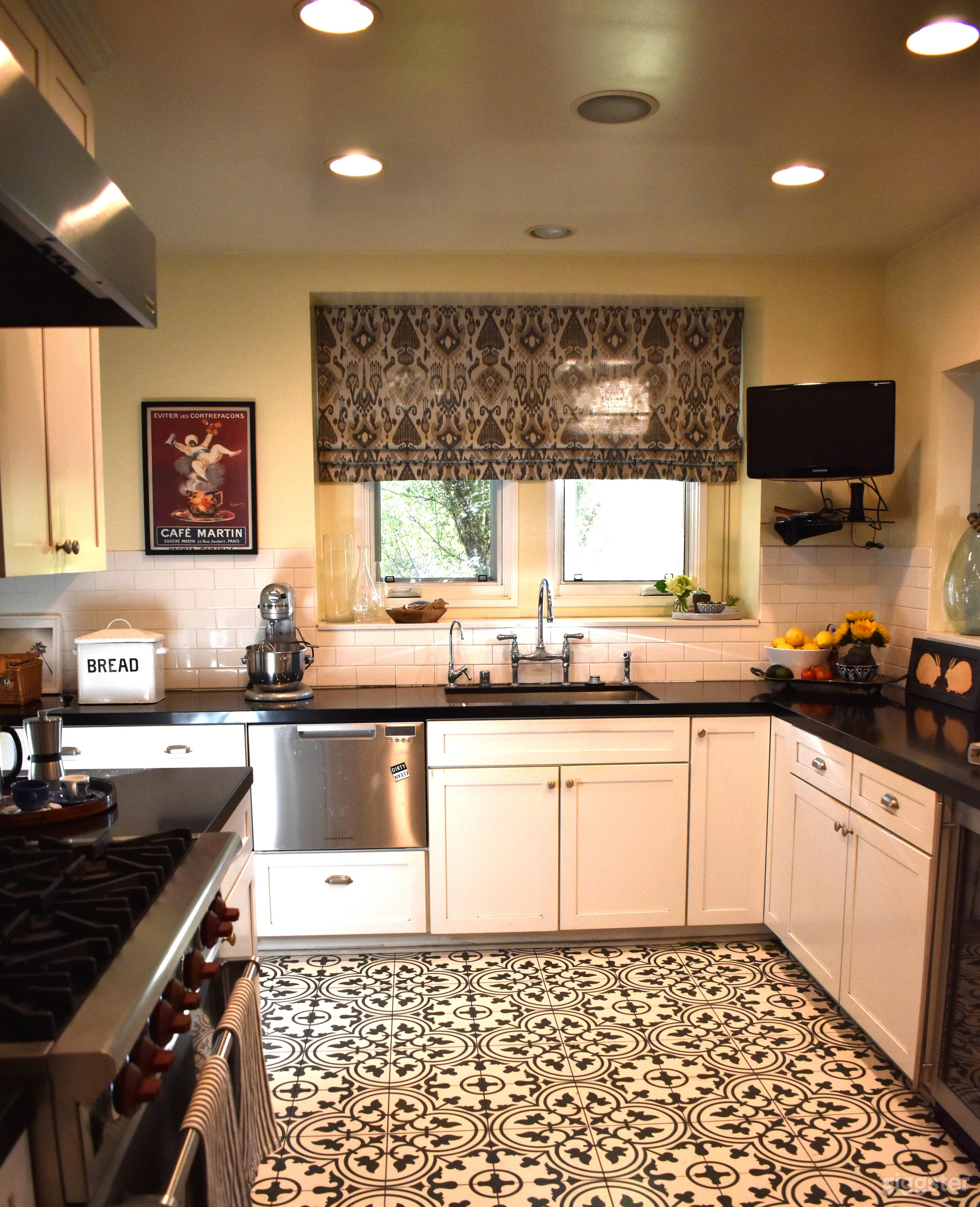 L-shaped kitchen, stainless steel appliances, chef's range ceramic tile floor