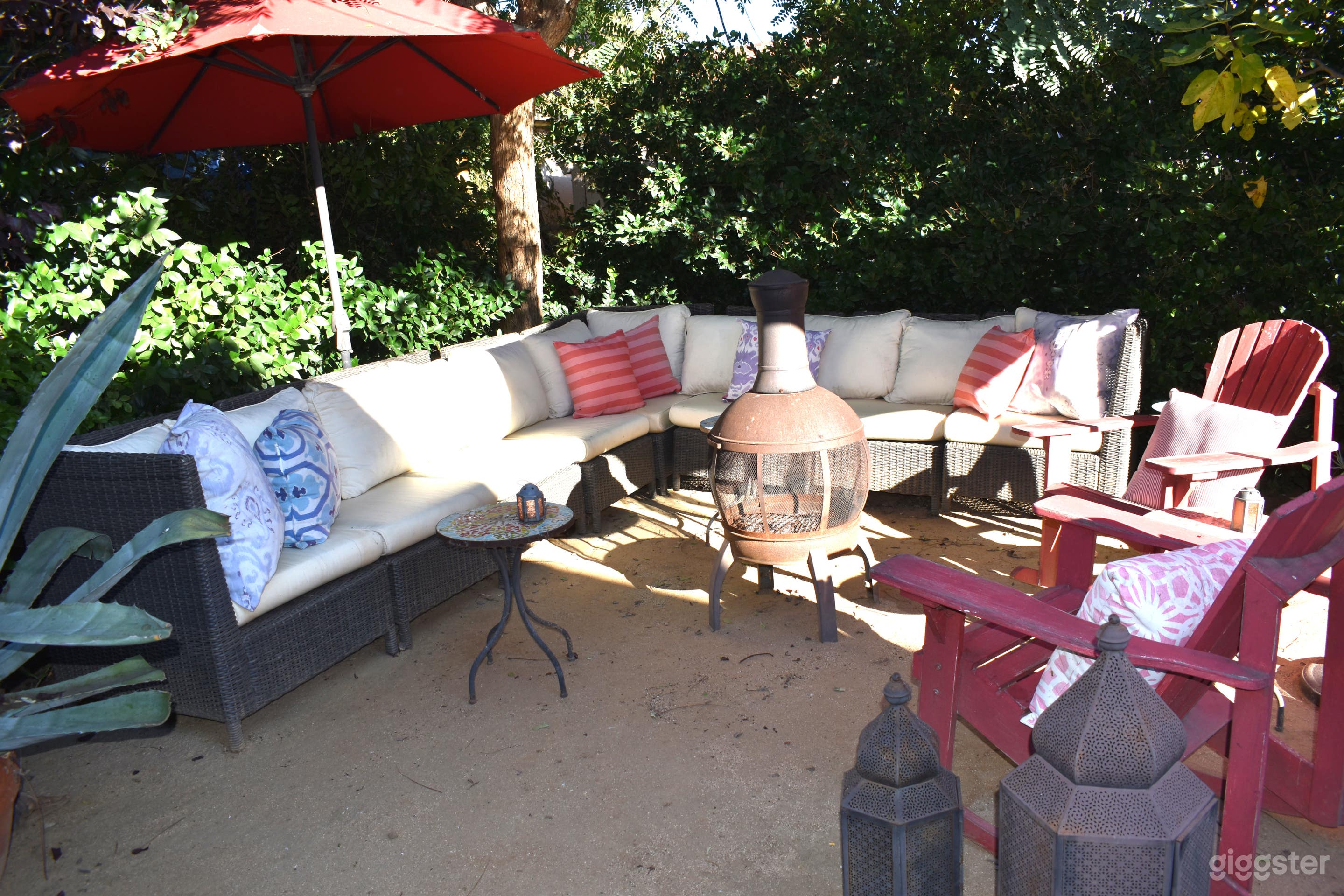 One of two backyard 
lounges with fire pit and adirondeck rocking chairs