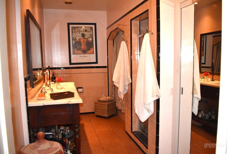  4 piece Master bath with original 1937 pink tiles throughout the room  