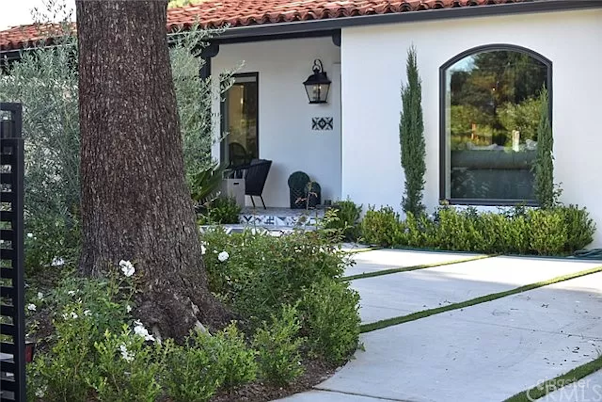 Wrap around driveway with large picture window