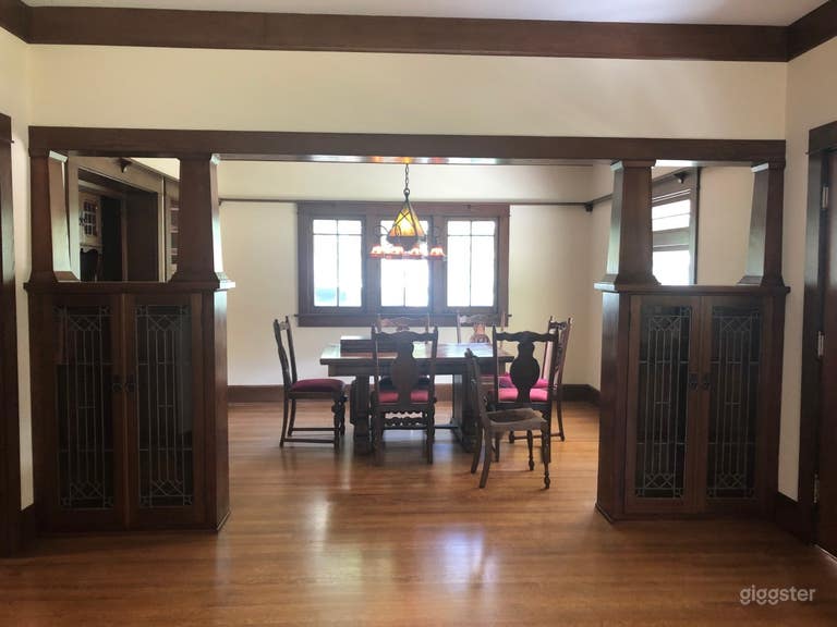  Dining room with cabinets and chandelier. 