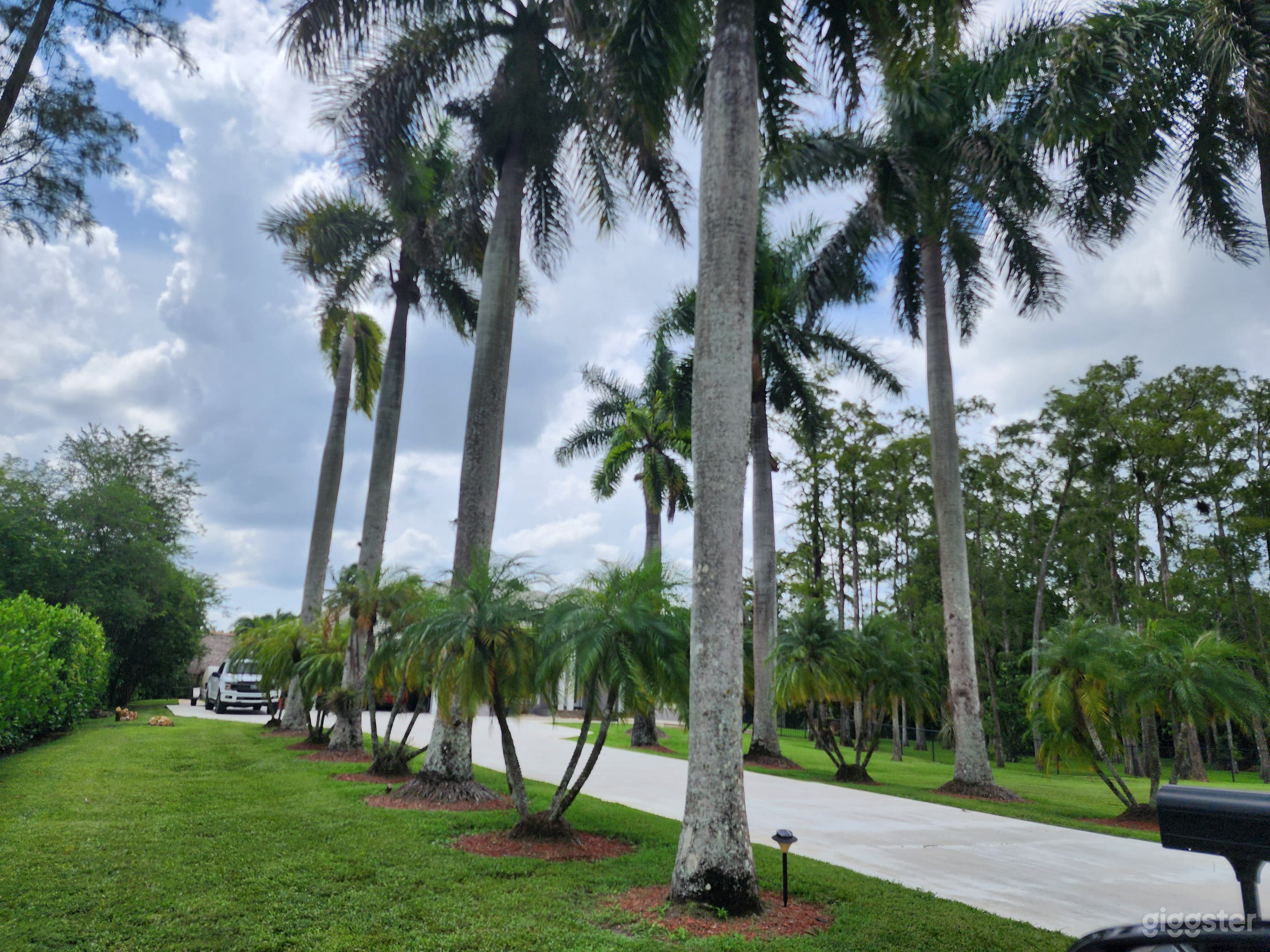 Our long driveway offers a stunning backdrop for photos and parking. 
We offer a valet service to our nearest lot for your guests as well