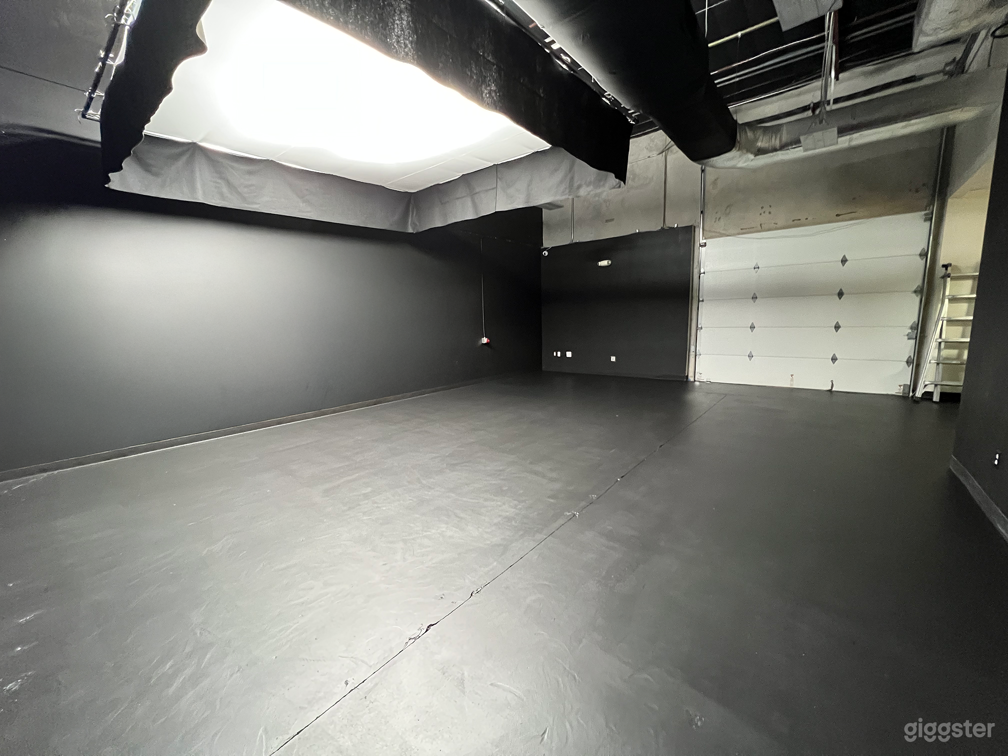 Studio space looking at the rear with bay door