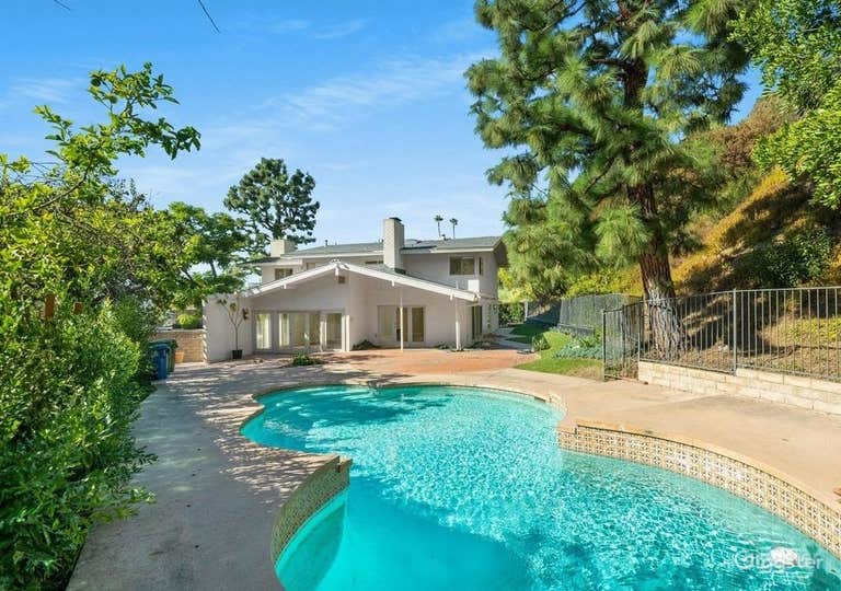   A Splendid pool and fire pit in a spacious yard 