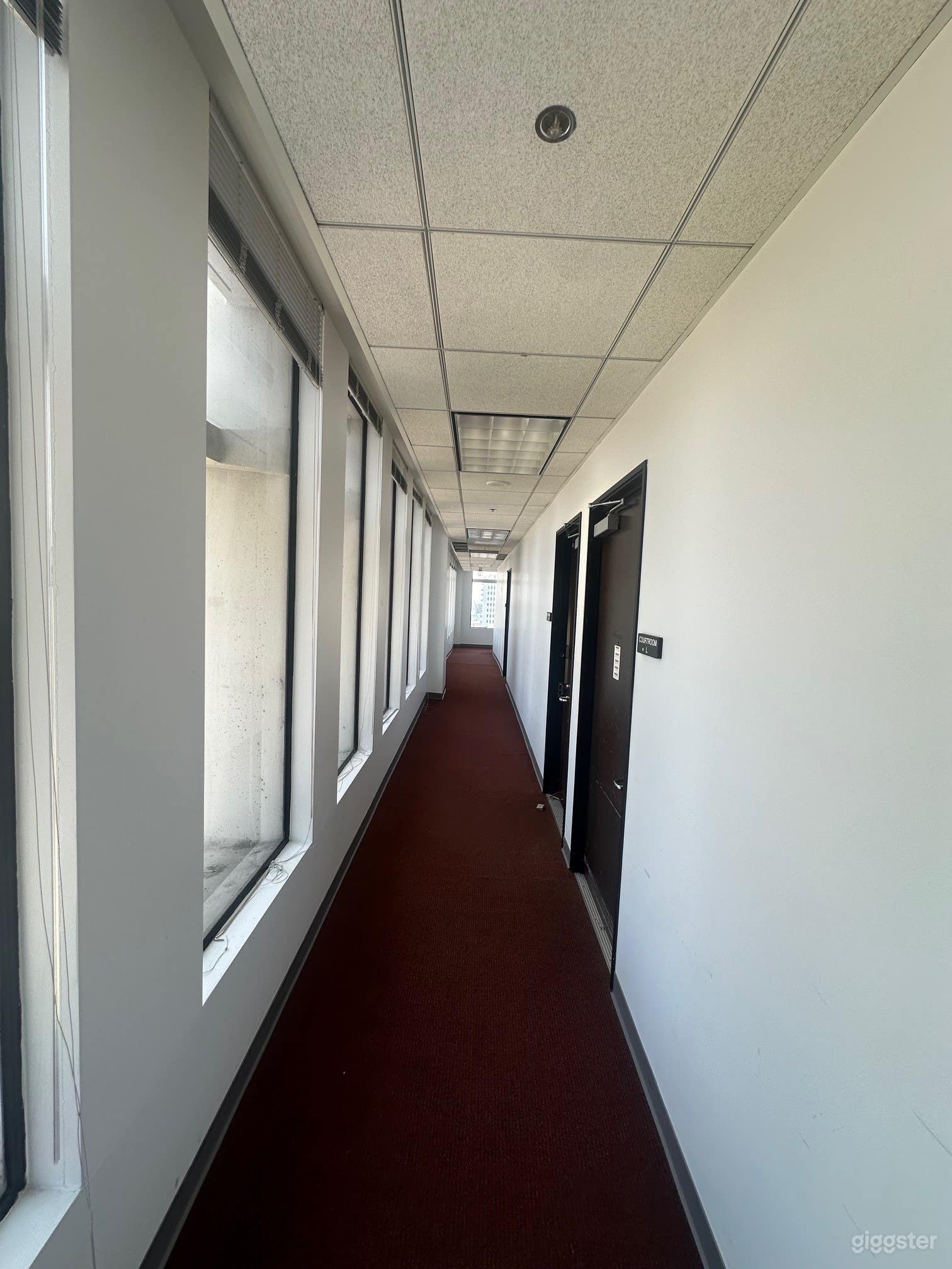 Spacious Vacated Courtroom with Long Hallways Photo 2