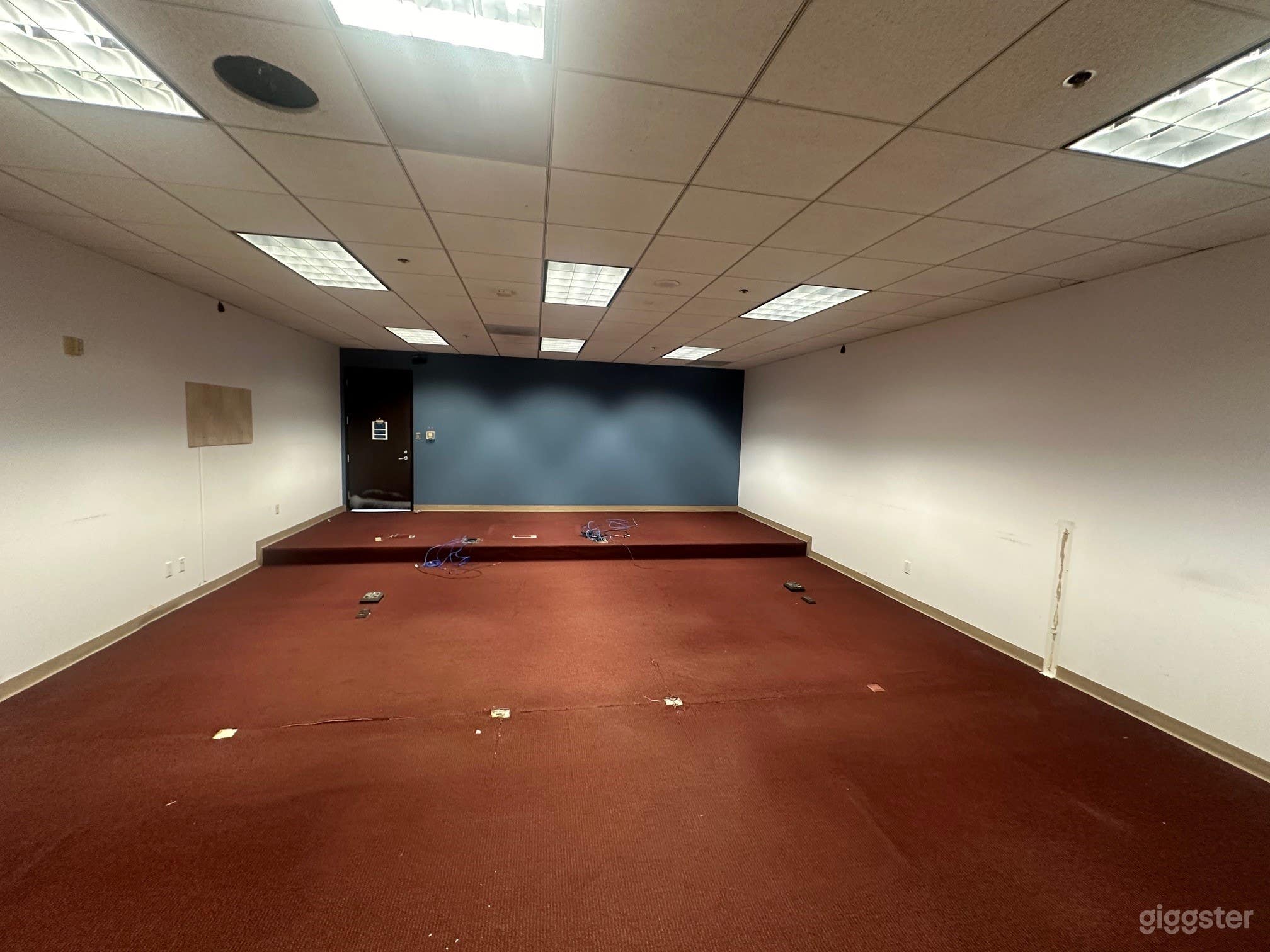 Spacious Vacated Courtroom with Long Hallways Photo 1