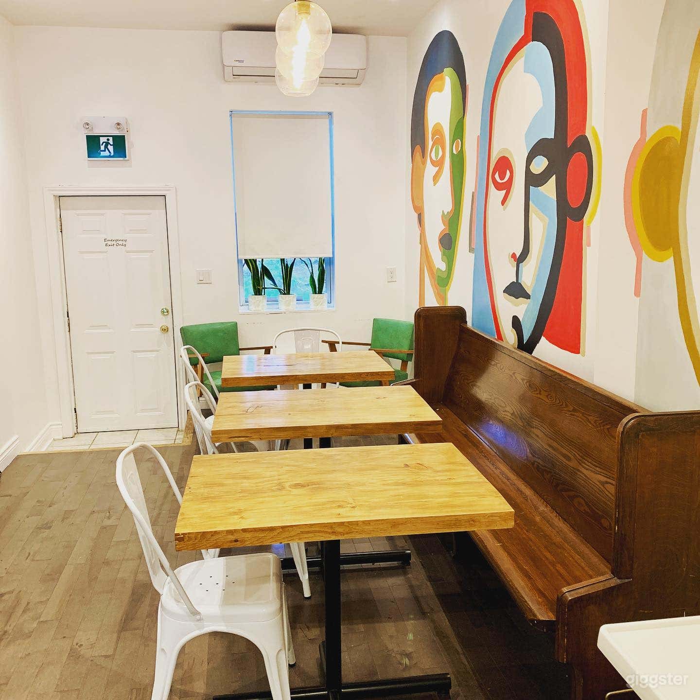 Bright Modern Cafe with Vibrant Murals and Patio Photo 3