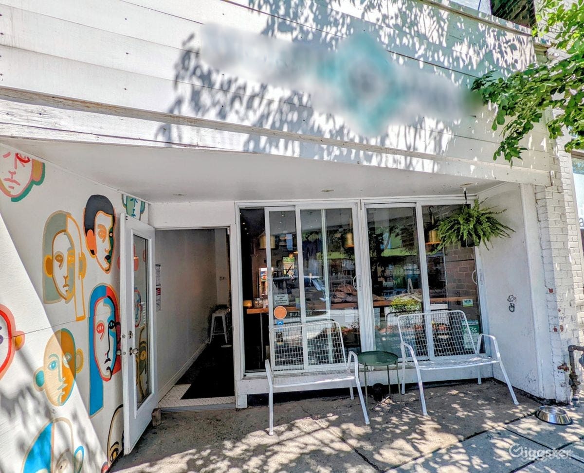 Bright Modern Cafe with Vibrant Murals and Patio Photo 2