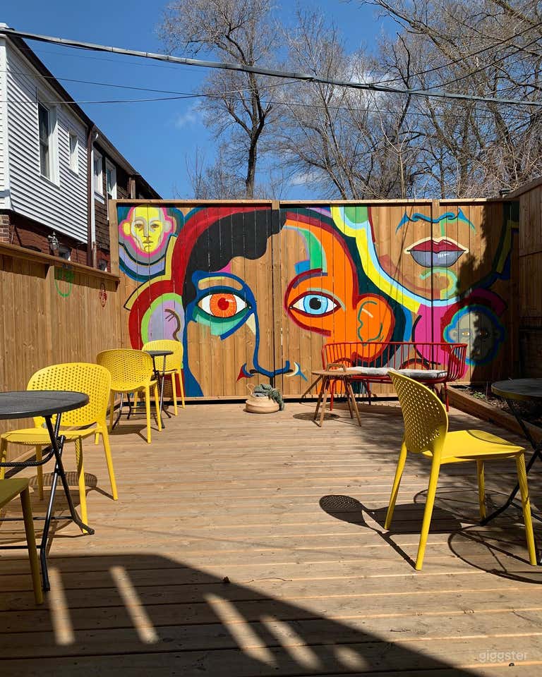  Bright, private garden patio with colourful murals 