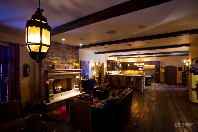  The Great Room flows into a modern open kitchen with stainless steel appliances and cement countertops 