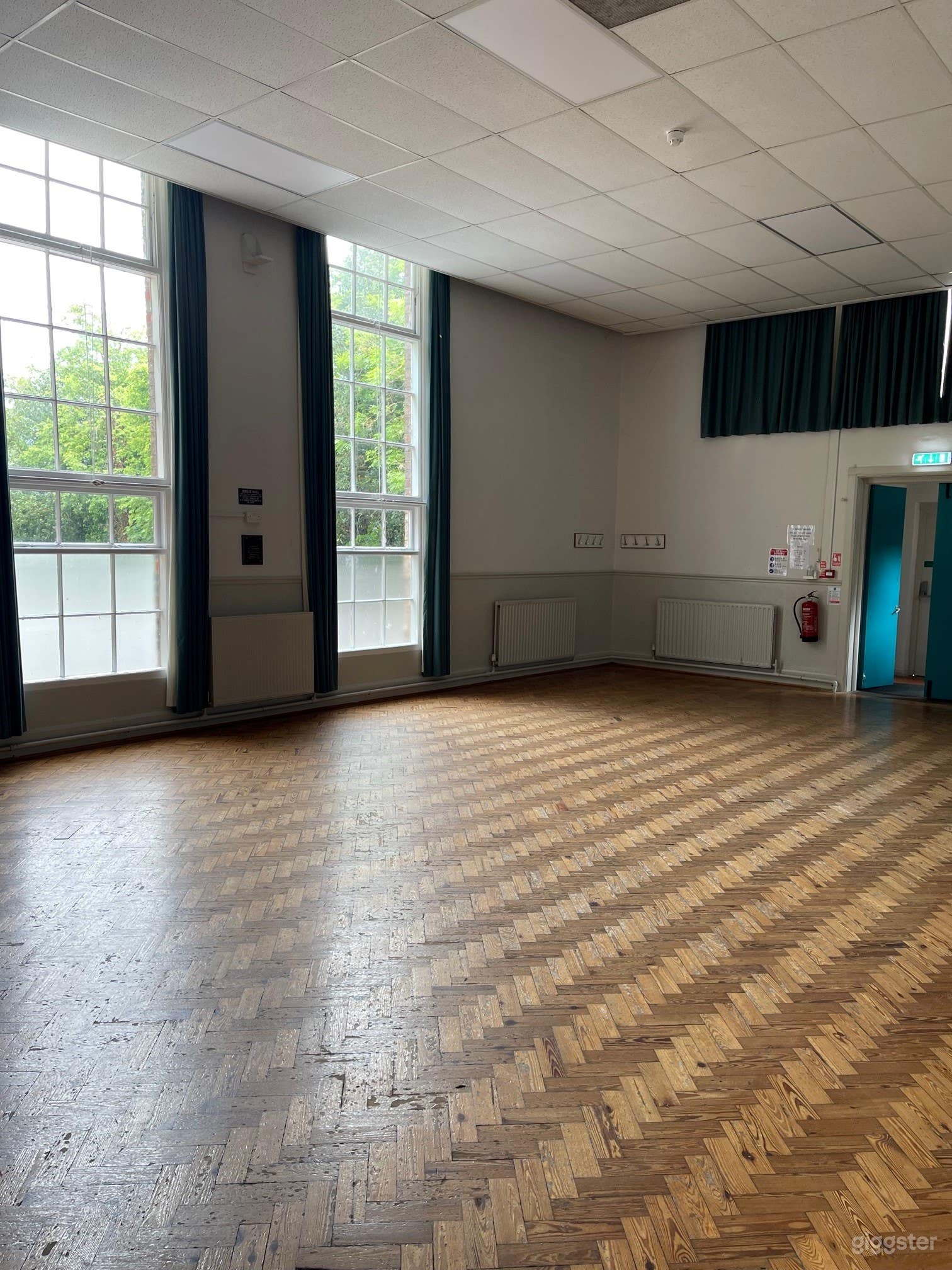 Hall with Parquet Flooring and Large Windows