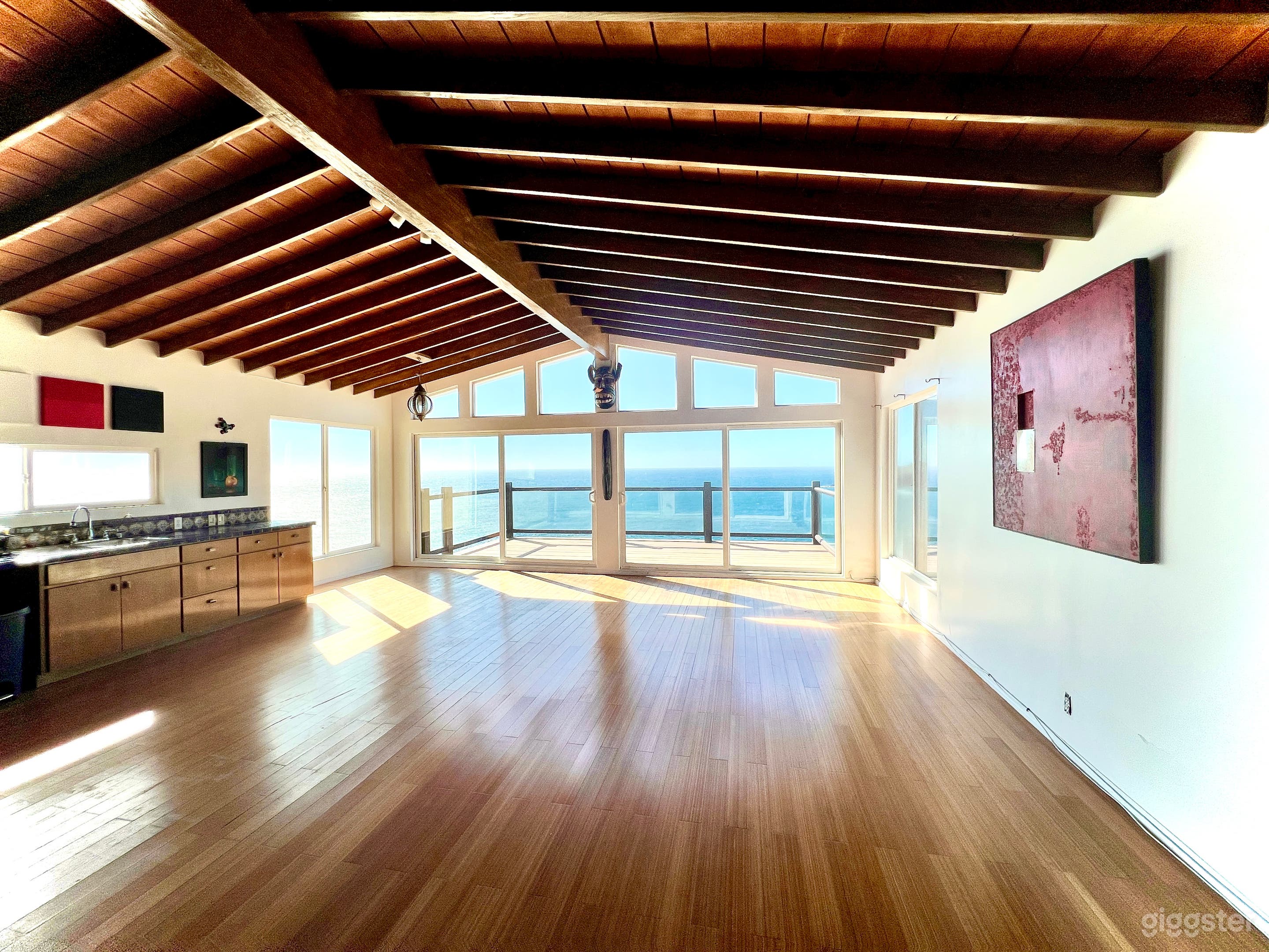 Modular open space living room with incredible West facing ocean views of the horizon and sunset. 

HIGH ceilings and beautiful secondary light great for shooting.