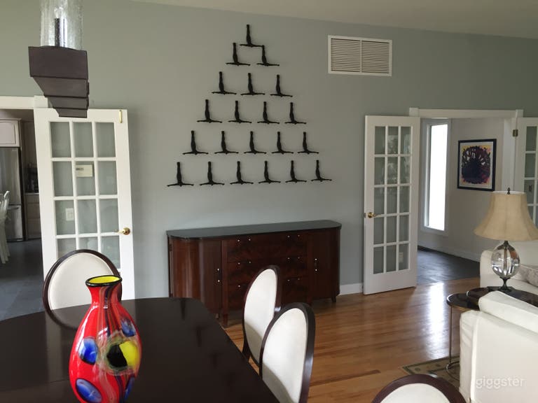  dining room french doors open into the kitchen and is part of the larger living room/dining room space 