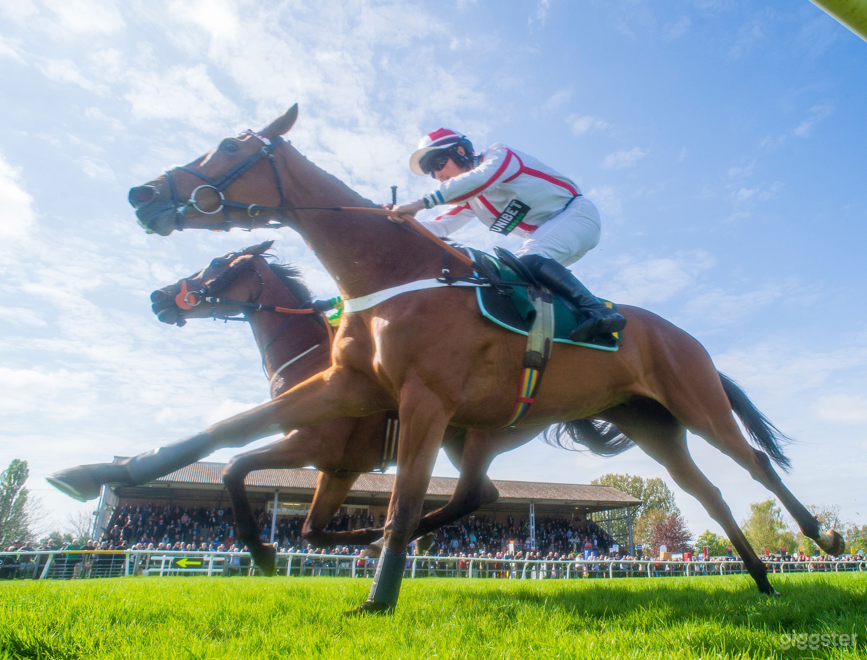 Coming up to the finish line with the roar of the crowd from the Grandstand.