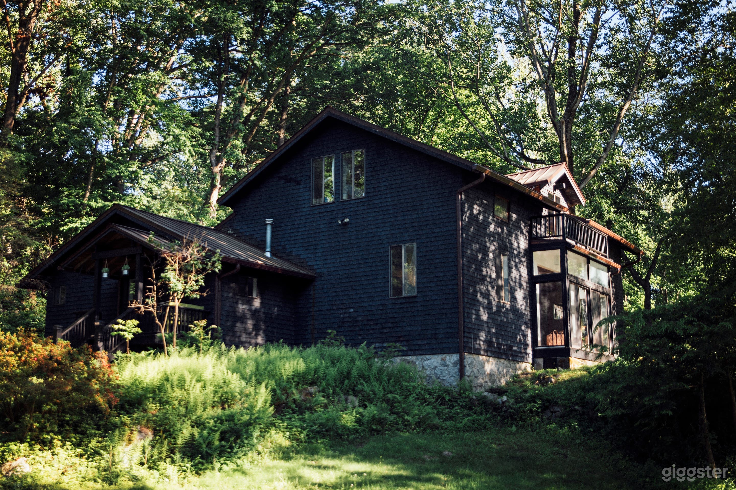 The Charming Black Barn from the gravel driveway