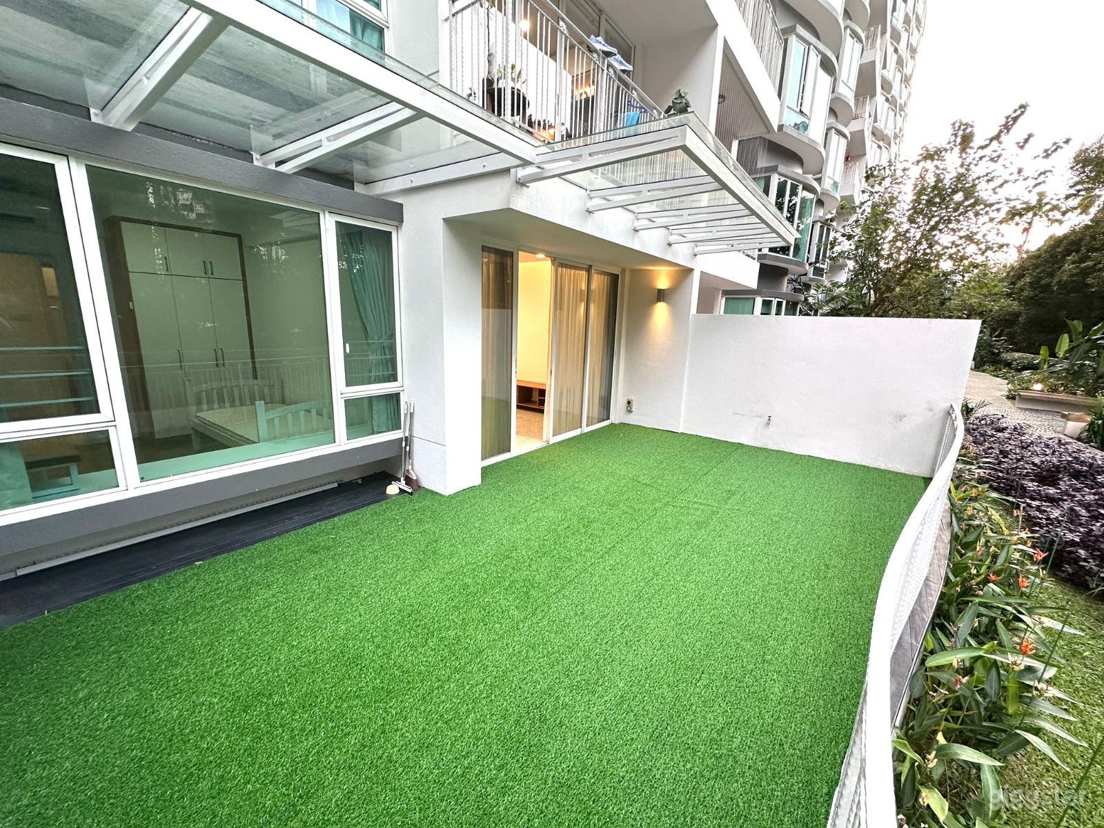 Condo Unit with Outdoor Patio facing Greenery Photo 3