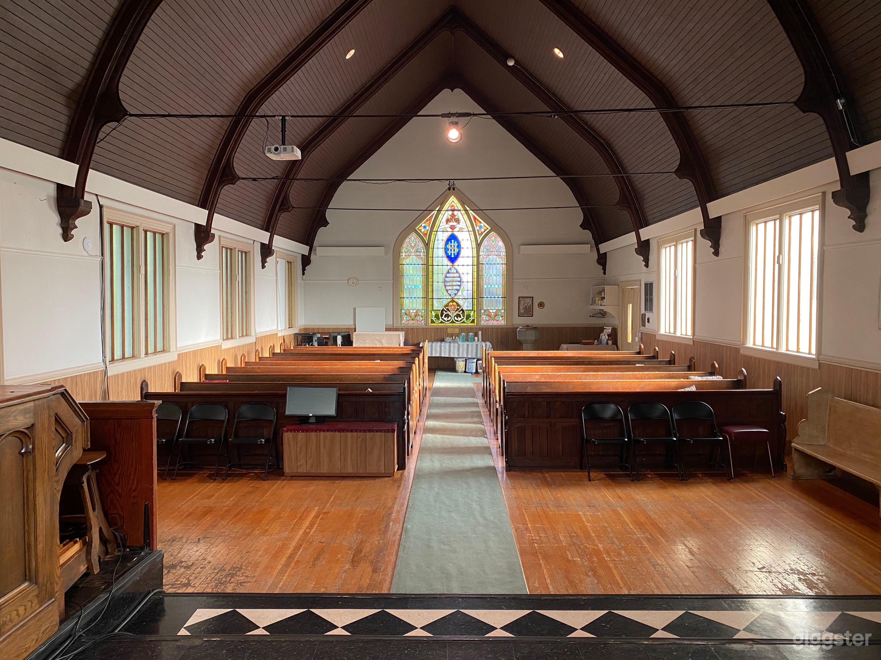 Historic Sanctuary with Stained Glass Windows Photo 1