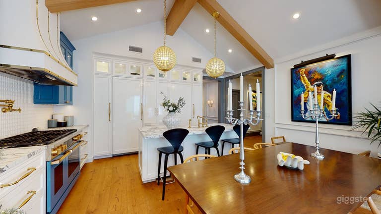  Vaulted (cathedral) ceilings with exposed beans. Custom stone kitchen hood  