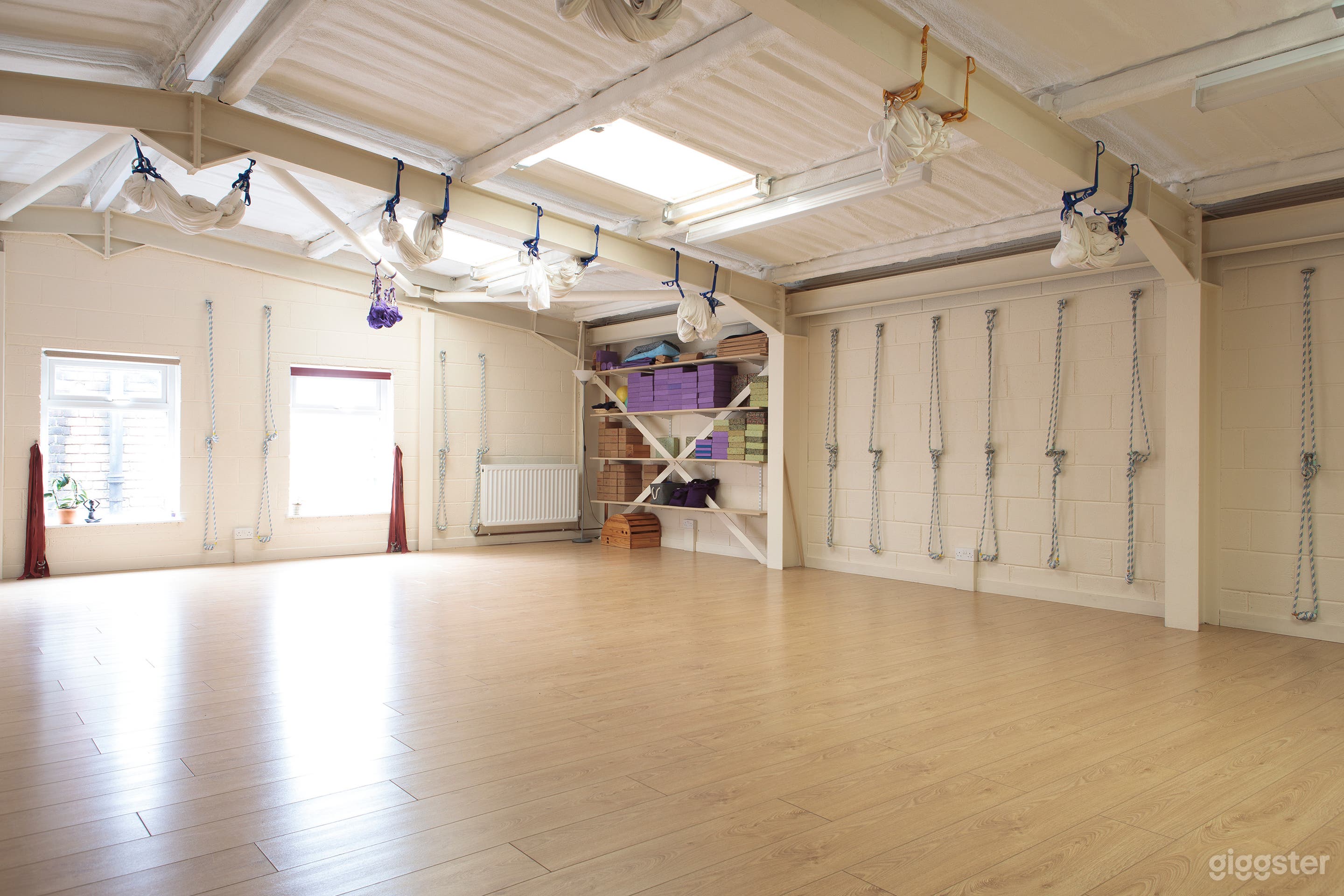 View showing shelving in back corner and wall yoga ropes (can be removed)
