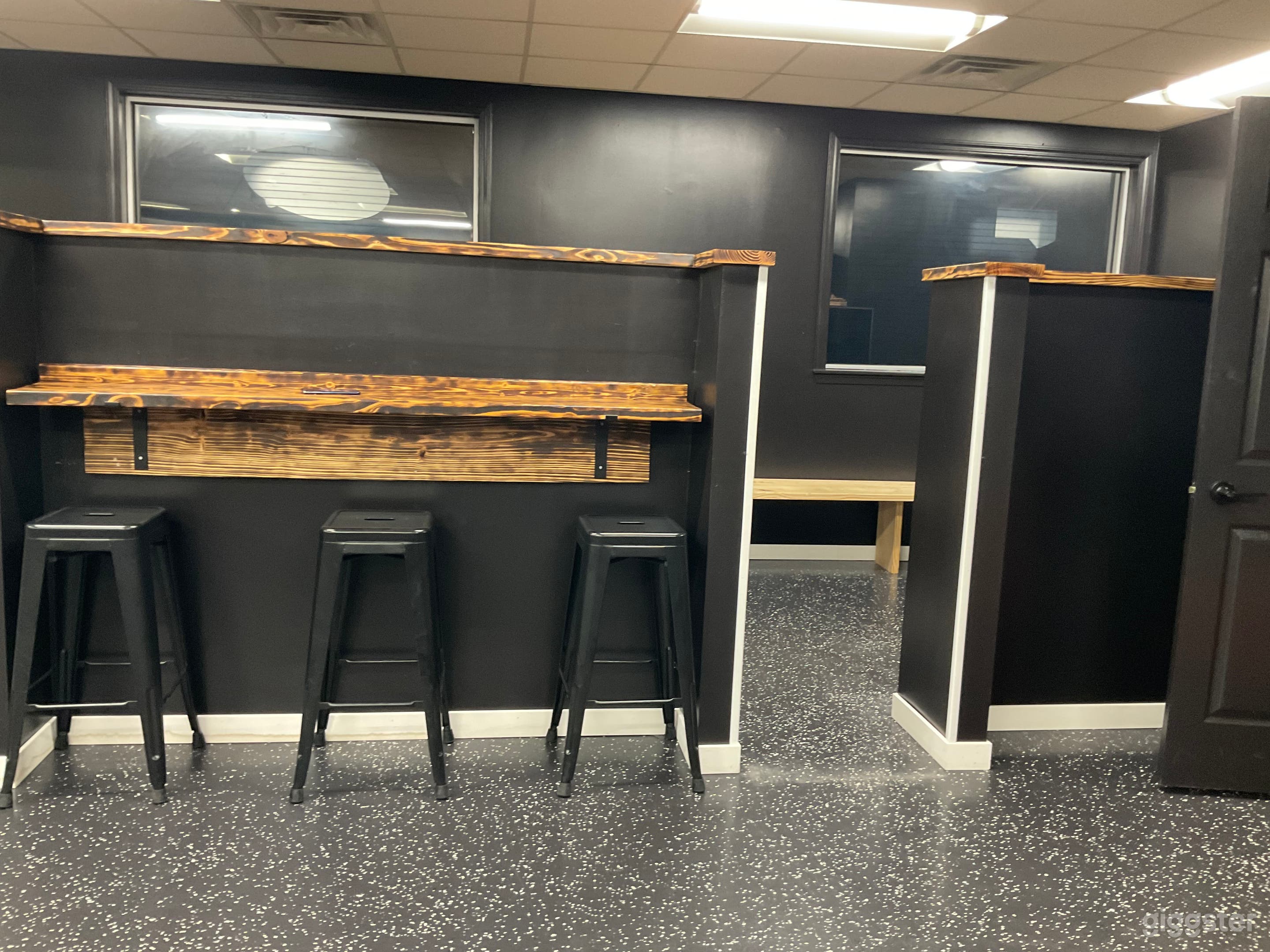 Private booths available with seating and 55' TV in each booth.