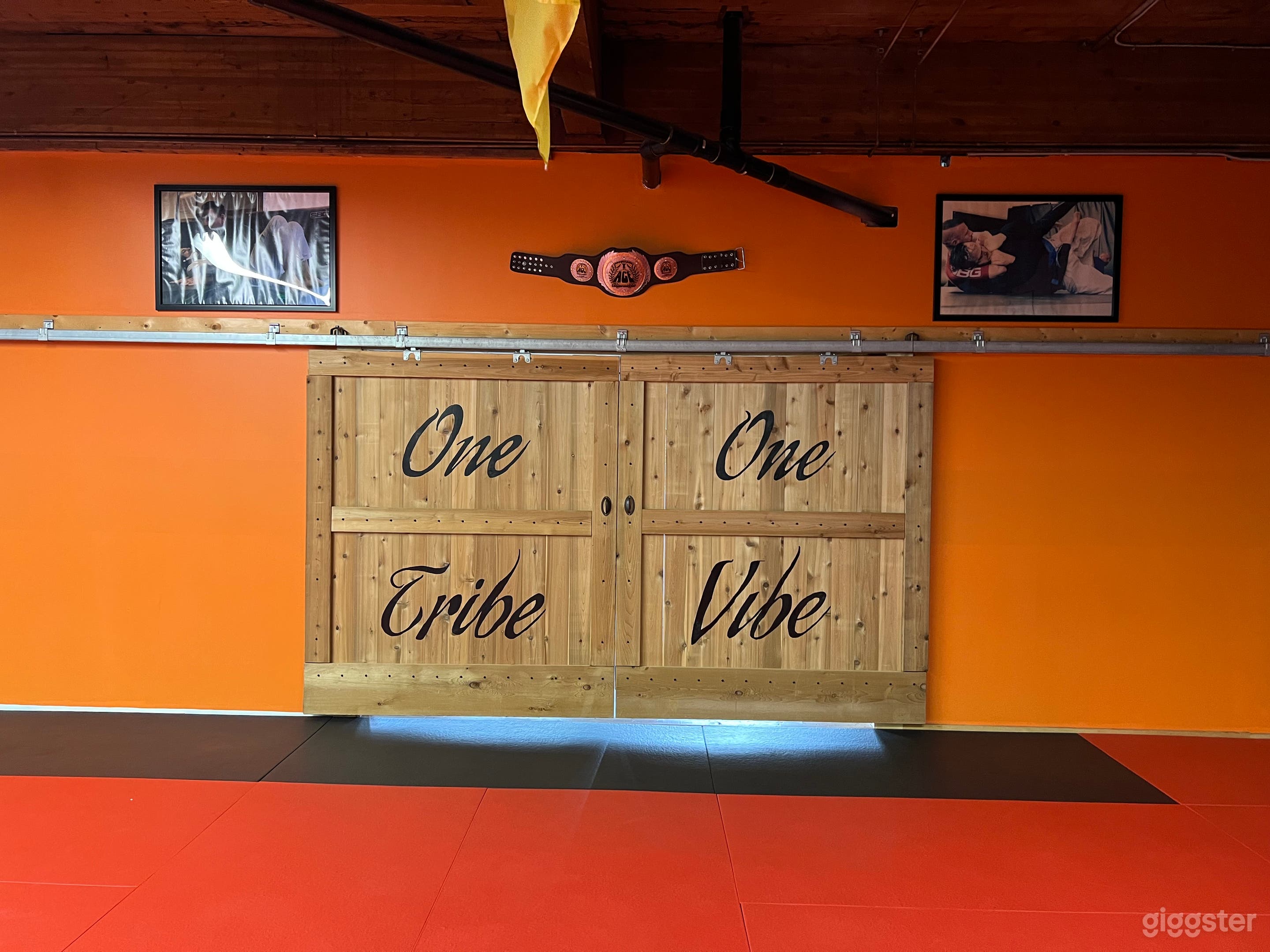 These custom built barn style doors help to separate the two rooms and their open  concept make it easy to transform the room into separate