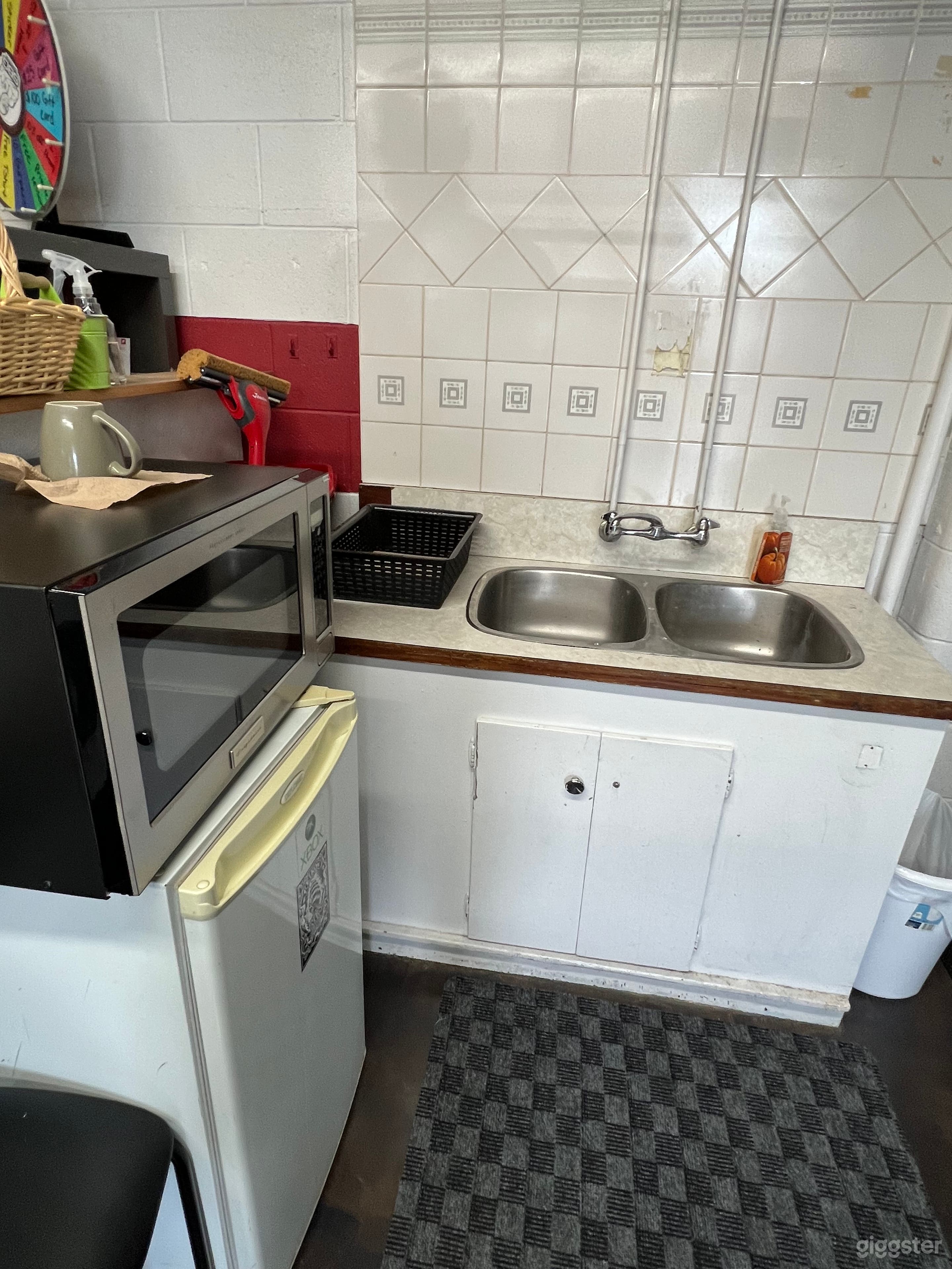 Microwave, mini fridge, sink and coffee maker