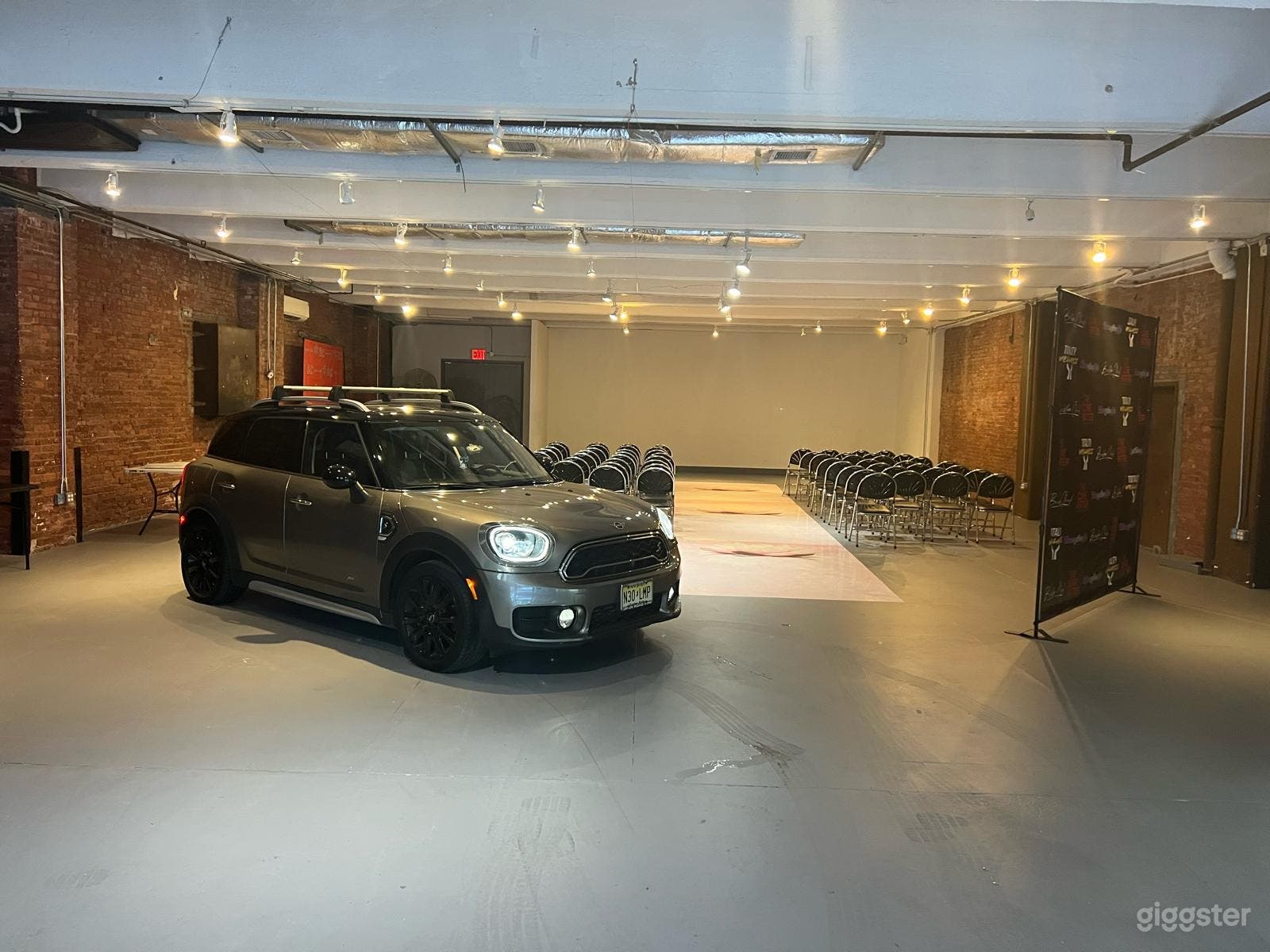 Studio 1 with gray flooring! Vacant but for Mini Might! This 3500 square foot space is both modern and adaptable!