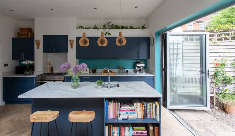  Kitchen with breakfast bar and doors open to patio garden 
